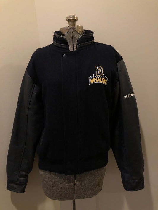 Kingspier Vintage - Dartmouth Whalers navy blue wool blend with leather trim varsity jacket. Jacket features Dartmouth whalers emblem on the chest and the back, “defence” embroidered on the left sleeve and “Forbes” embroidered on the right sleeve, insulated lining, two inside pockets, two slash pockets, zipper and snap closures. Made by Canada sportswear. Size small.