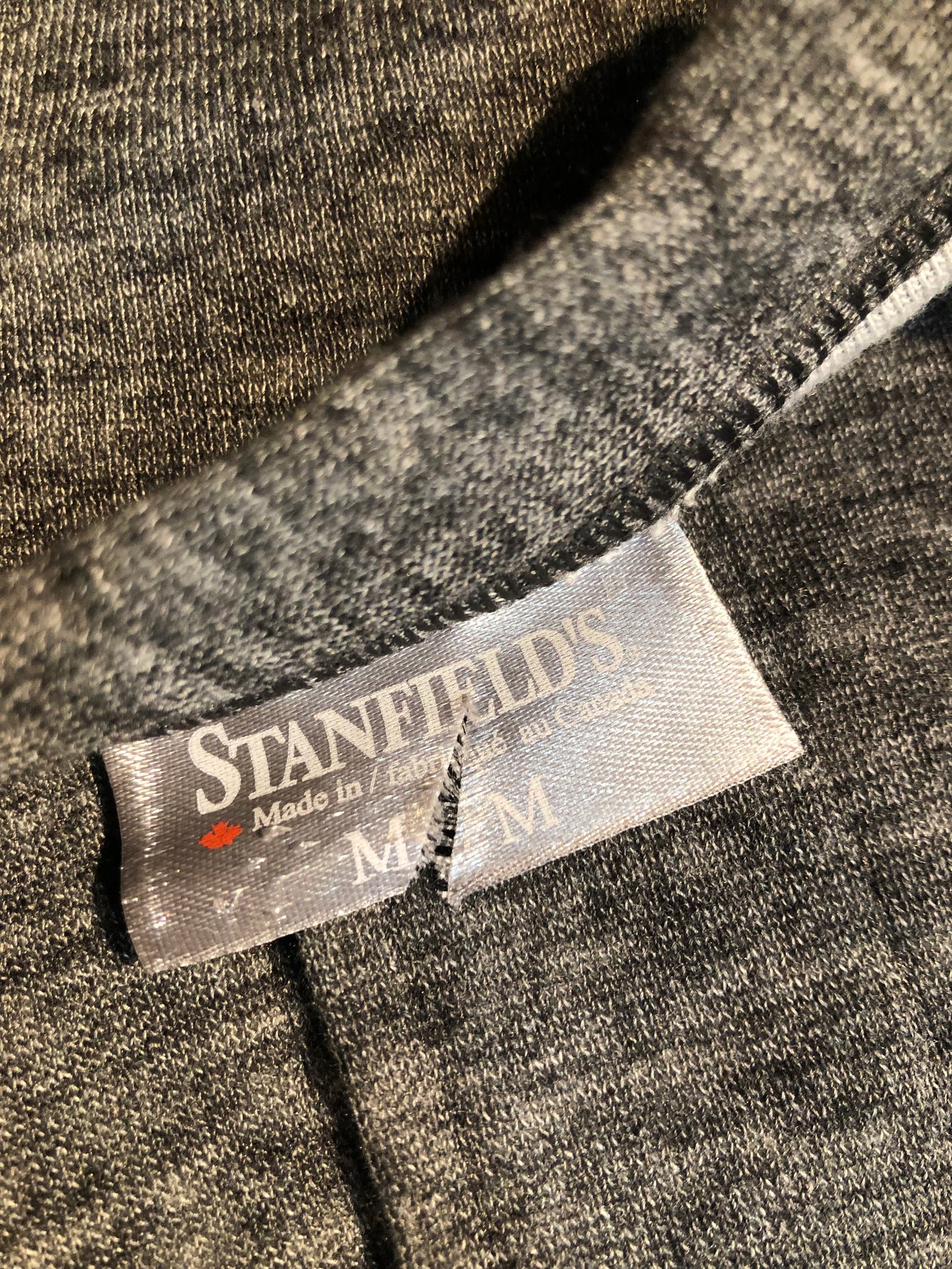 Kingspier Vintage - Stanfield''s deadstock duofold / layered jersey knit union suits in red or grey. The Stanfield's union suits are ingeniously designed with wicking and insulating layers of wool and cotton blends and have been a "staple" of Stanfield’s for many decades. Inner Layer: 50% Cotton/ 50% Polyester Outer Layer: 50% merino wool/ 50% Polyester These onsies are irregular/seconds...we're calling them “I’mperfects” as imperfections are undetectable.