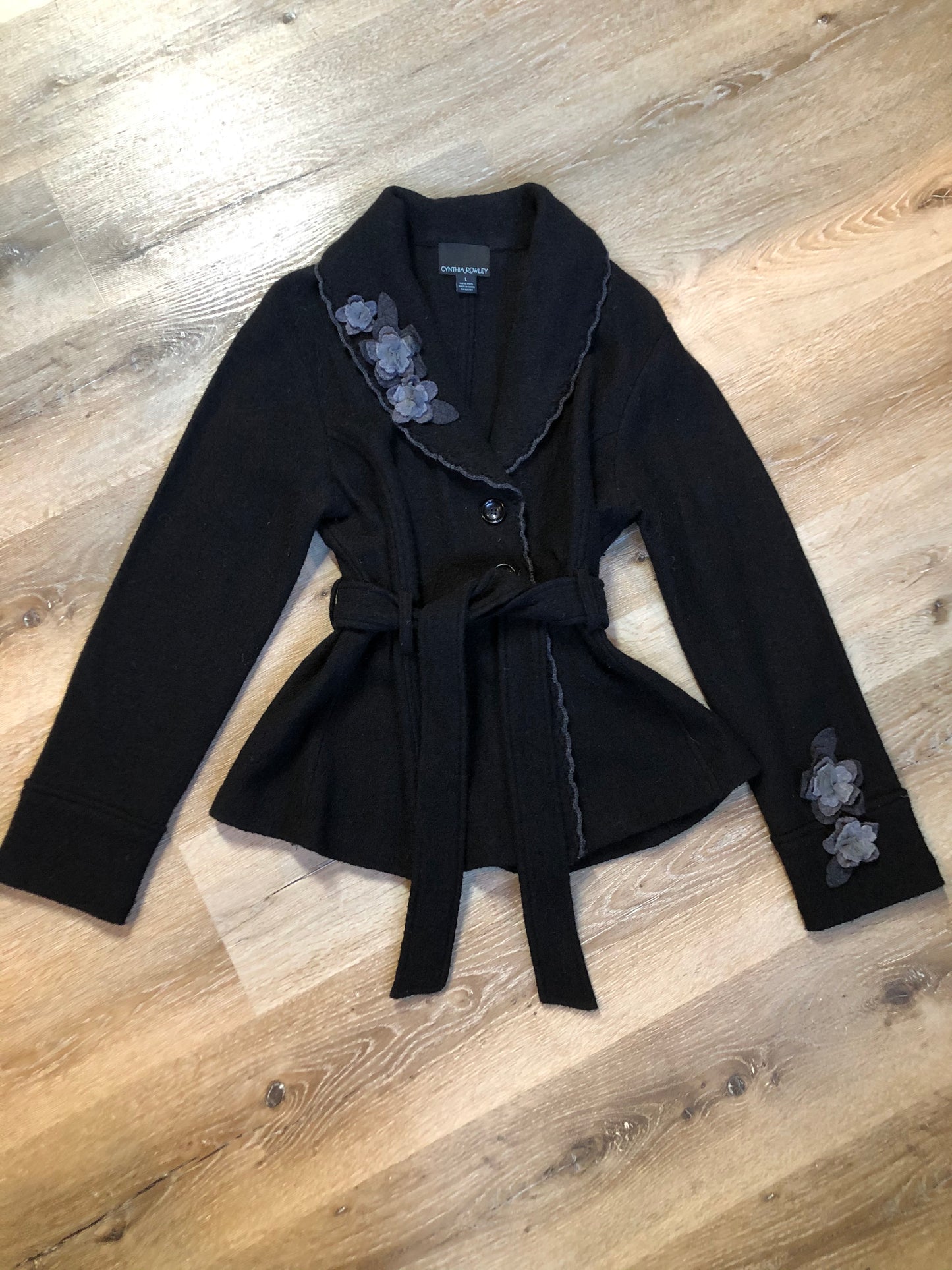 Kingspier Vintage - Cynthia Rowley black belted wool cardigan with buttons and grey wool flower details. Size medium.