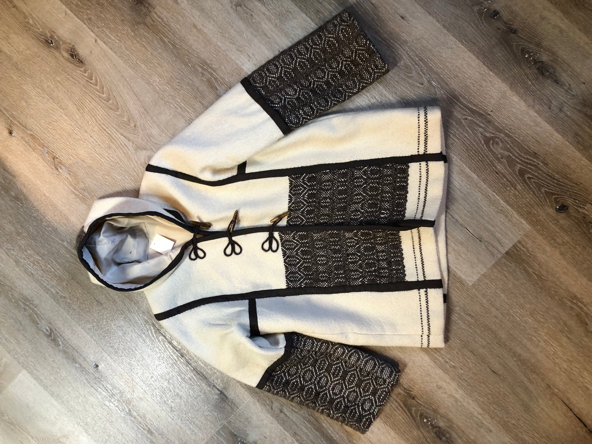 Kingspier Vintage - Vintage handwoven and handmade beige 100^ natural wool cardigan with hood, wooden toggles and inner lining. Made in Nova Scotia. Size medium.