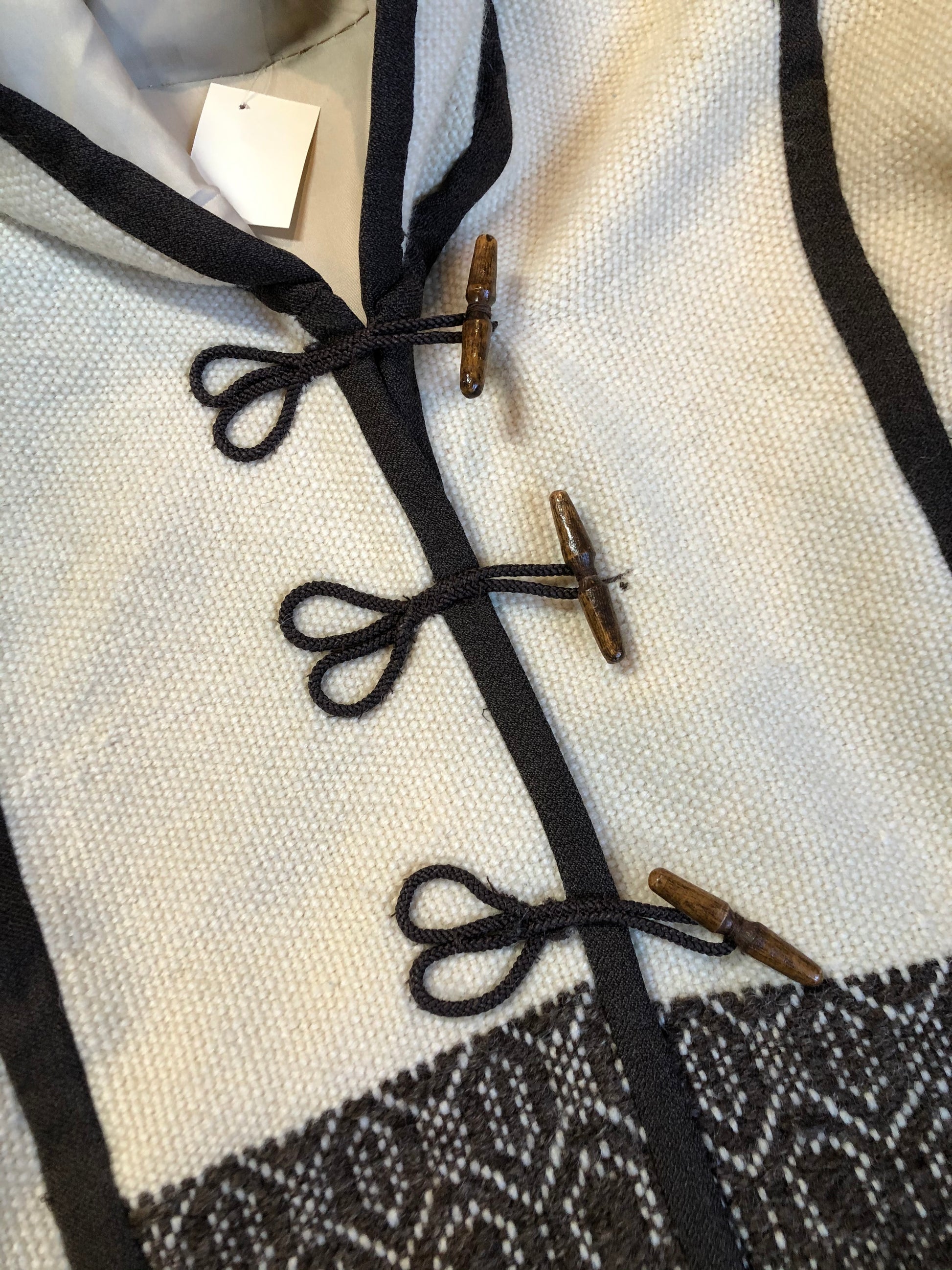 Kingspier Vintage - Vintage handwoven and handmade beige 100^ natural wool cardigan with hood, wooden toggles and inner lining. Made in Nova Scotia. Size medium.