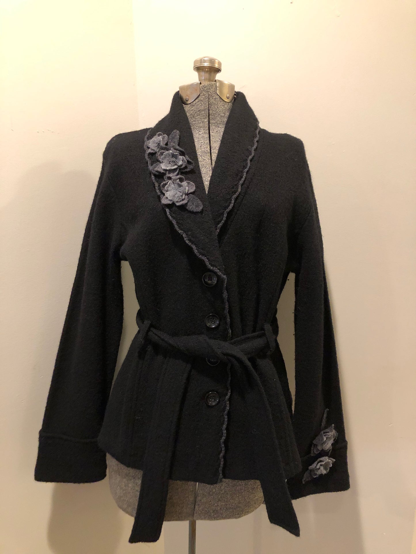 Kingspier Vintage - Cynthia Rowley black belted wool cardigan with buttons and grey wool flower details. Size medium.