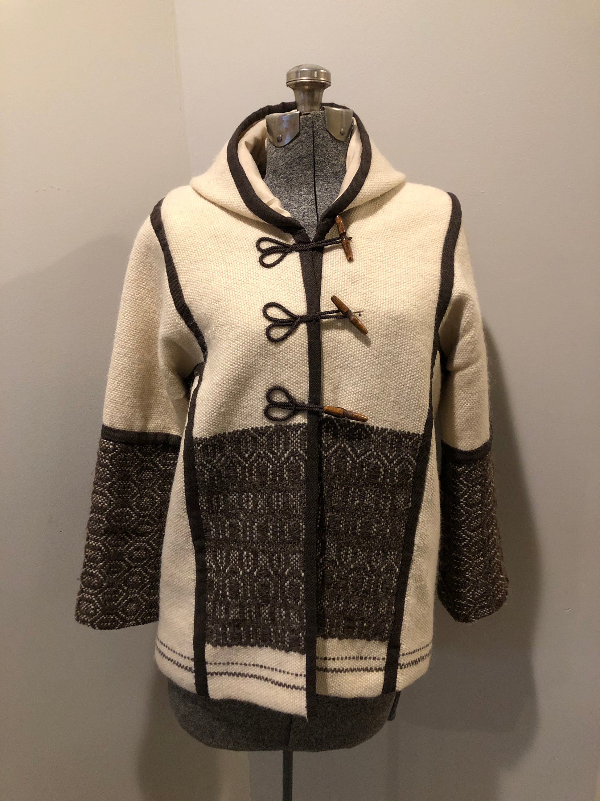 Kingspier Vintage - Vintage handwoven and handmade beige 100^ natural wool cardigan with hood, wooden toggles and inner lining. Made in Nova Scotia. Size medium.