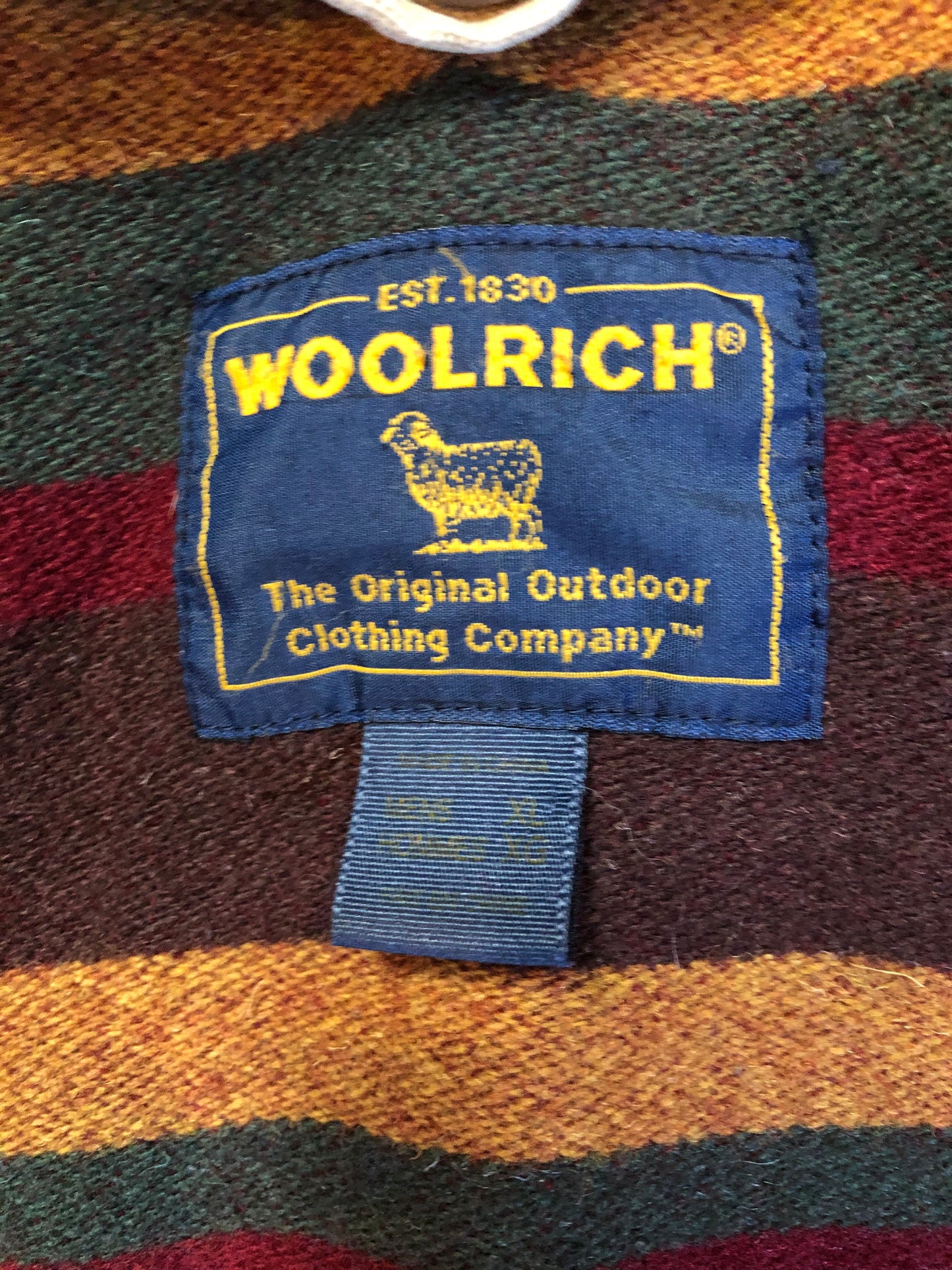 Kingspier Vintage - Woolrich beige chore jacket with cotton shell, leather collar, wool blend lining, snap closures and two flap pockets. Size XL.