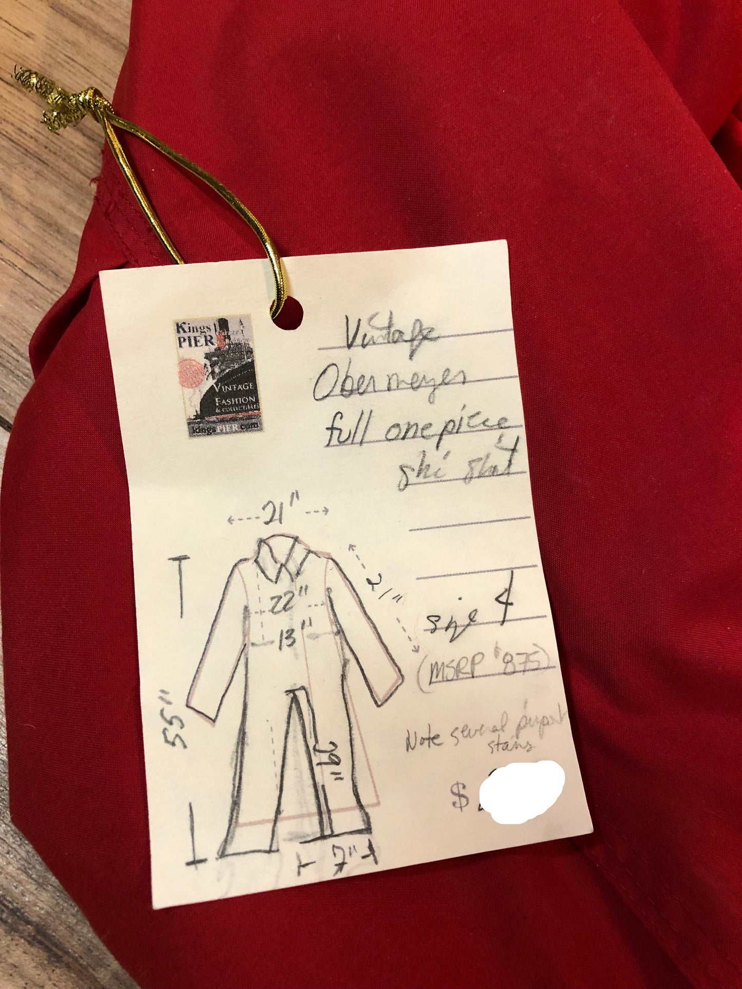 Kingspier Vintage - Vintage Obermeyer red one piece ski suit with suede belt, packable hood, quilted lining, zipper closure and multiple zip pockets.