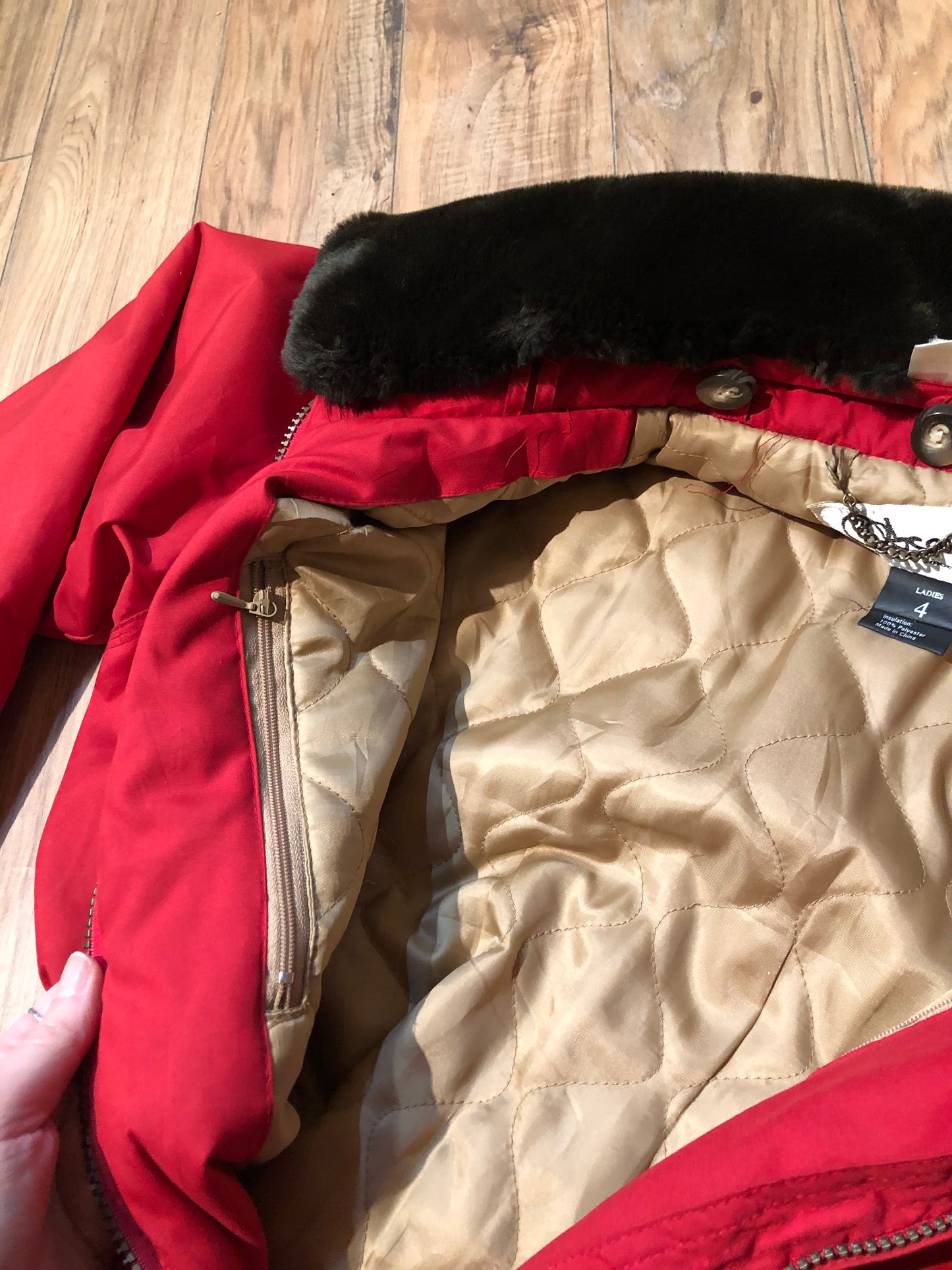 Kingspier Vintage - Vintage Obermeyer red one piece ski suit with suede belt, packable hood, quilted lining, zipper closure and multiple zip pockets.