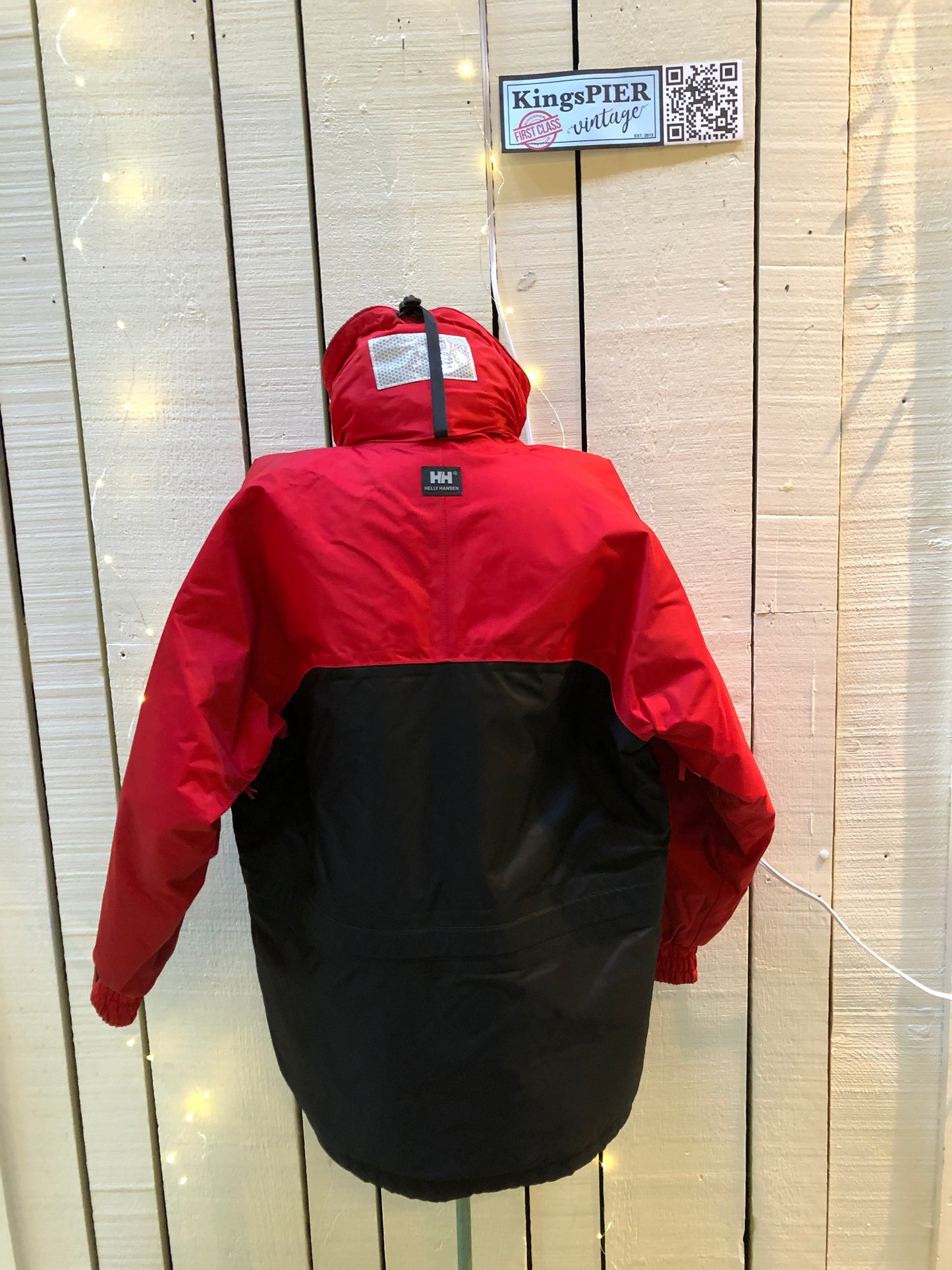 Kingspier Vintage - Helly Hansen red and black Soft Flex Echo Parka with Personal Flotation Device, Canadian Coast Guard approved.
Jacket features a packable hood, adjustable storm collar, zipper and snap closures, zip front pockets, waterproof shell, and PVC foam buoyant component.
Size Small.