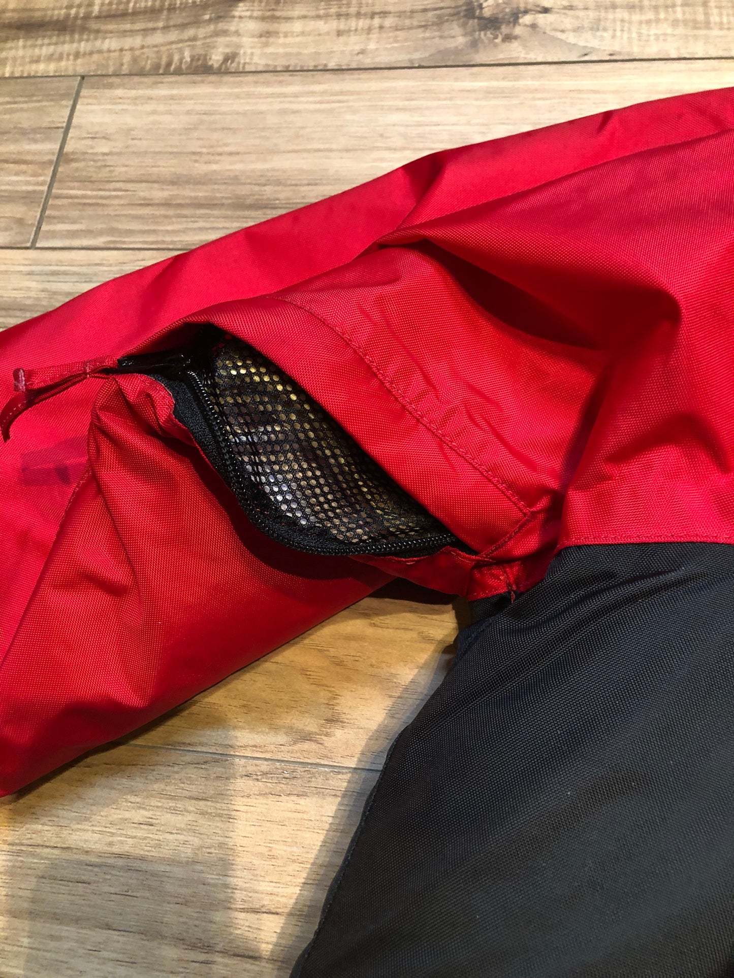 Kingspier Vintage - Helly Hansen red and black Soft Flex Echo Parka with Personal Flotation Device, Canadian Coast Guard approved.
Jacket features a packable hood, adjustable storm collar, zipper and snap closures, zip front pockets, waterproof shell, and PVC foam buoyant component.
Size Small.