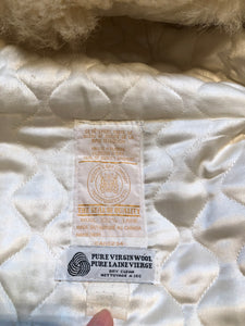 Kingspier Vintage - Vintage Hudson’s Bay Company white wool parka with embroidered northern indigenous design, fur trimmed hood, zipper closure, quilted lining and two front pockets.

Made in Canada.