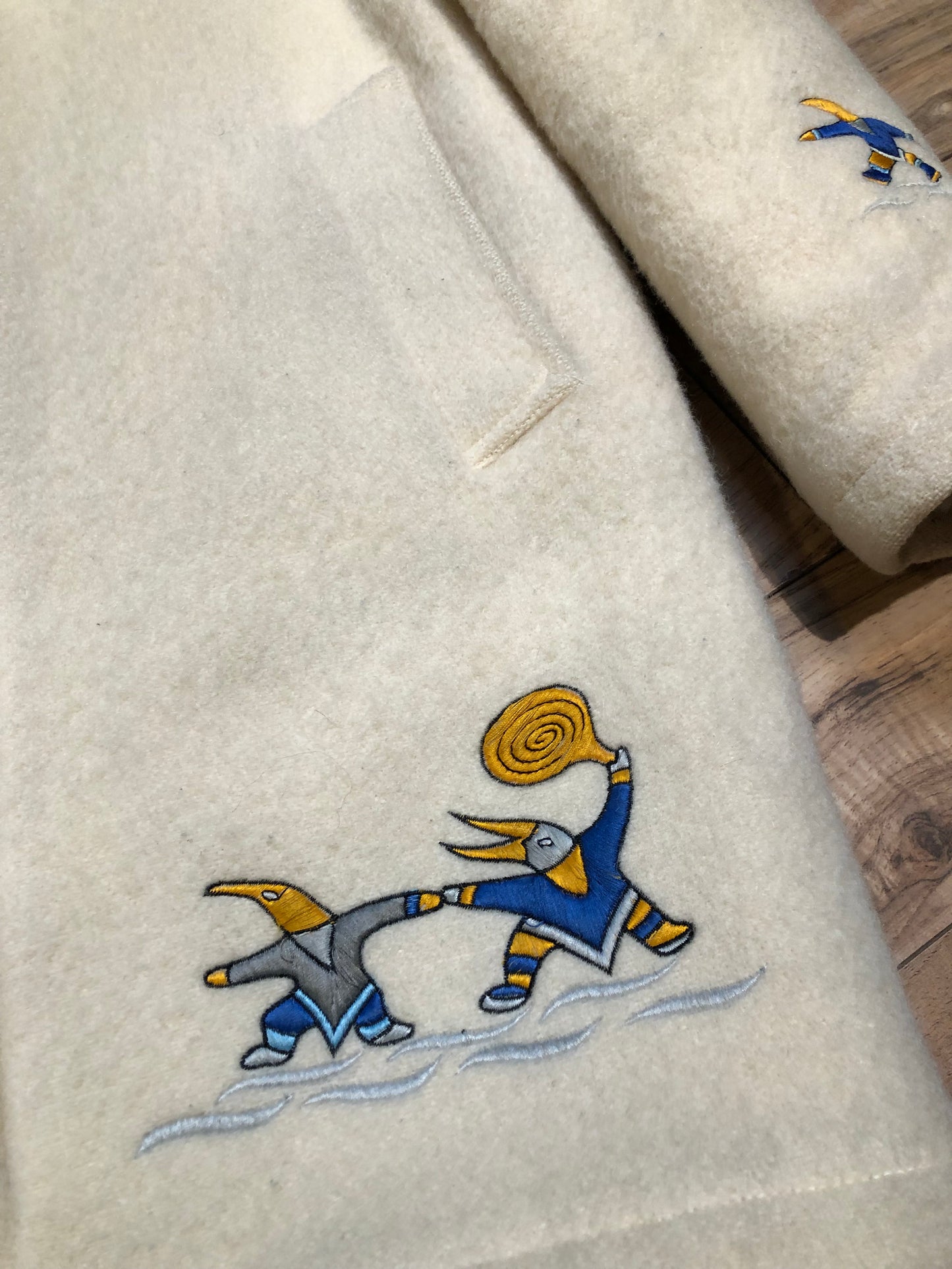 Kingspier Vintage - Vintage Hudson’s Bay Company white wool parka with embroidered northern indigenous design, fur trimmed hood, zipper closure, quilted lining and two front pockets.
Made in Canada.