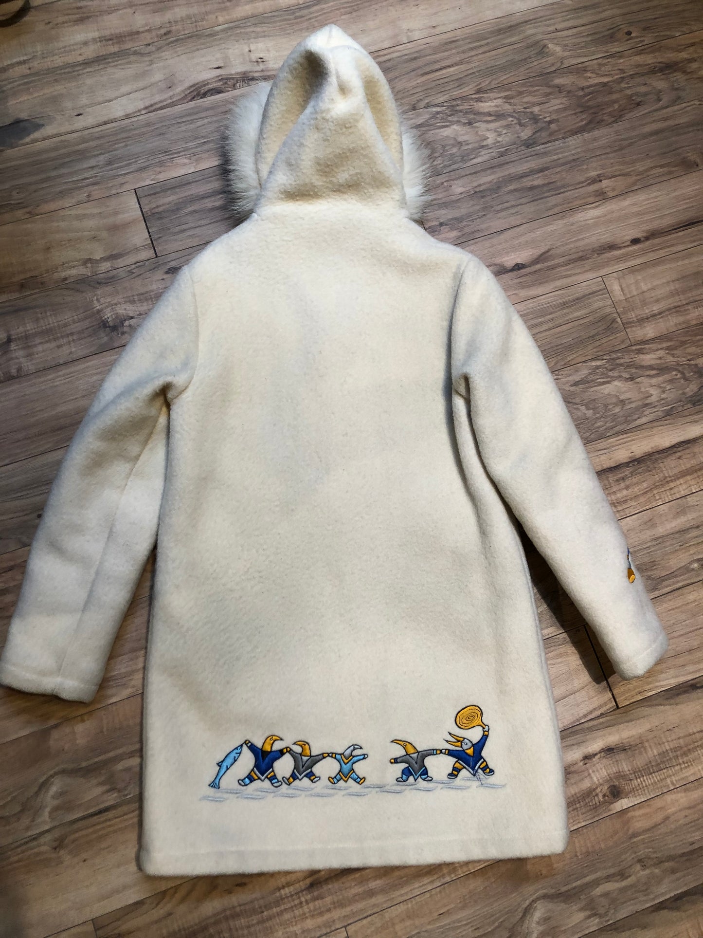 Kingspier Vintage - Vintage Hudson’s Bay Company white wool parka with embroidered northern indigenous design, fur trimmed hood, zipper closure, quilted lining and two front pockets.
Made in Canada.