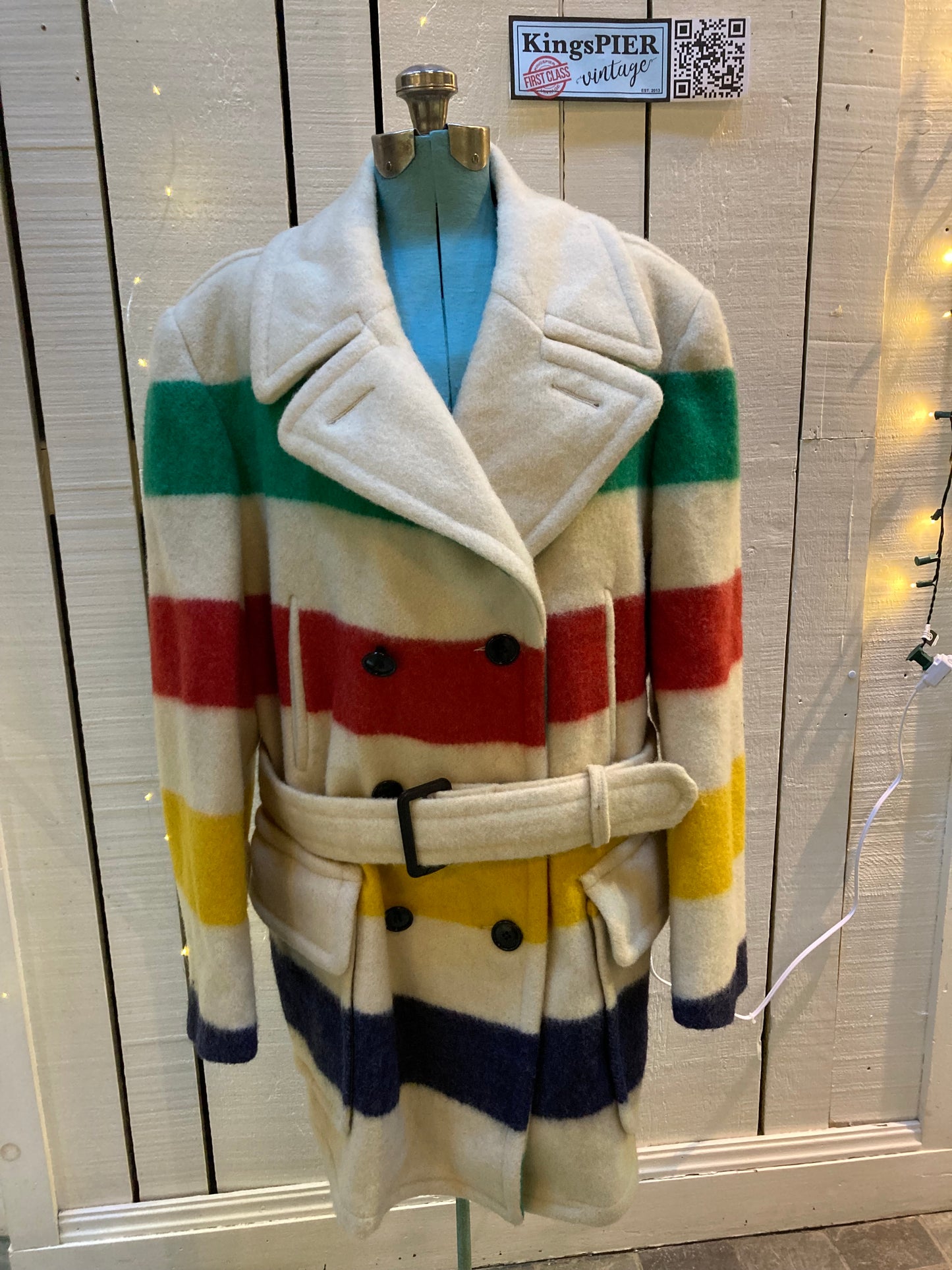 Kingspier Vintage - Vintage Hudson’s Bay Company iconic multi stripe point blanket coat with belt, double breasted button closures and front flap pockets.
Made in Canada.
Size Large.