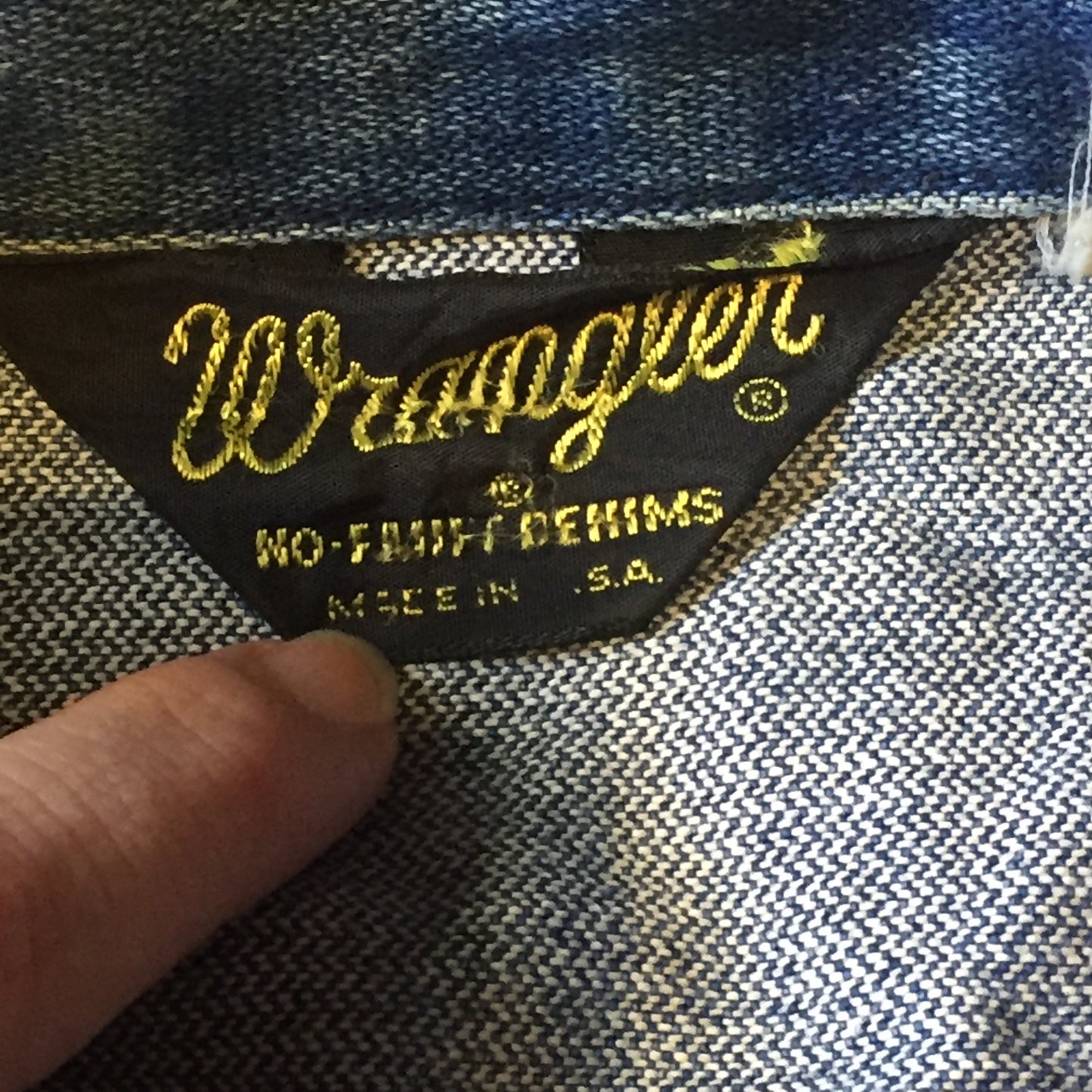 Kingspier Vintage - Vintage Wrangler medium wash denim jacket with iconic wrangler stitching, button closures, flap pockets on the chest and hand warmer pockets. Size medium. Made in USA.