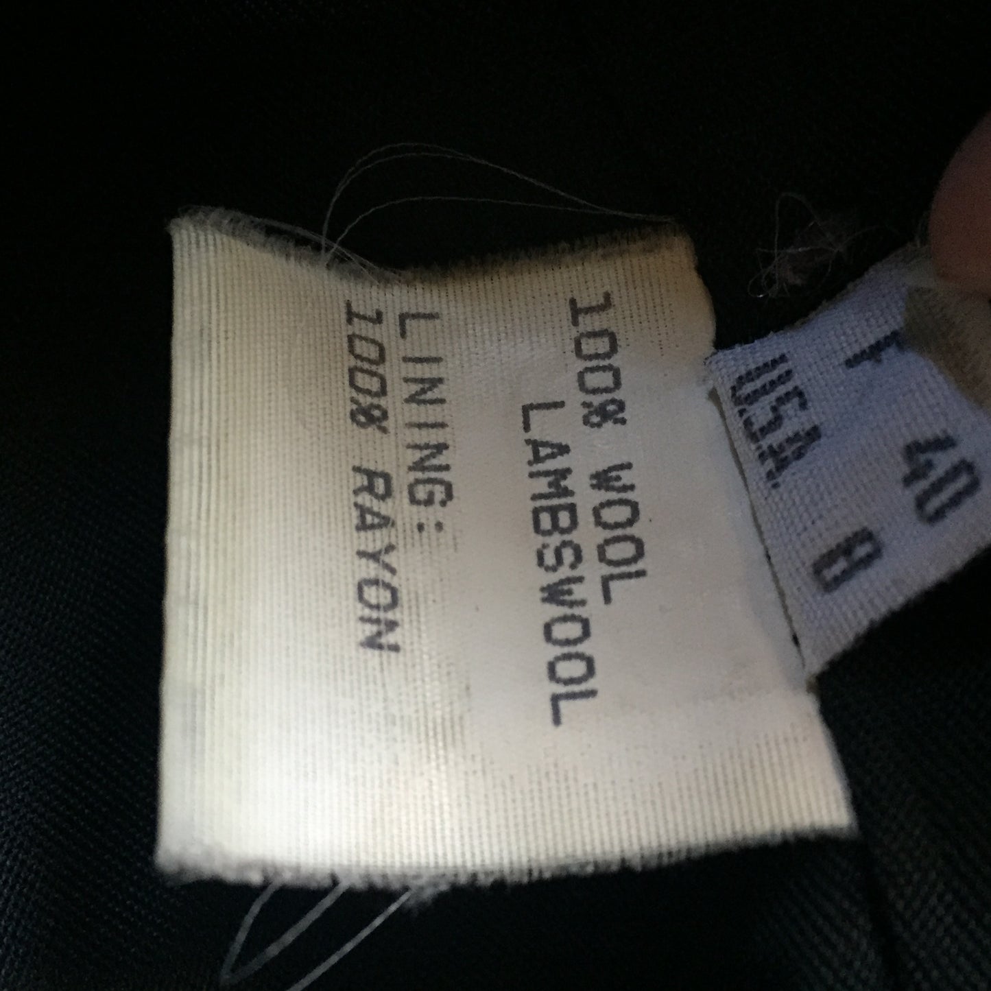 Kingspier Vintage - Bloomingdales dark grey 100% lambswool coat with button closures, vertical pockets and a rayon lining. Made in Italy. Size 8.