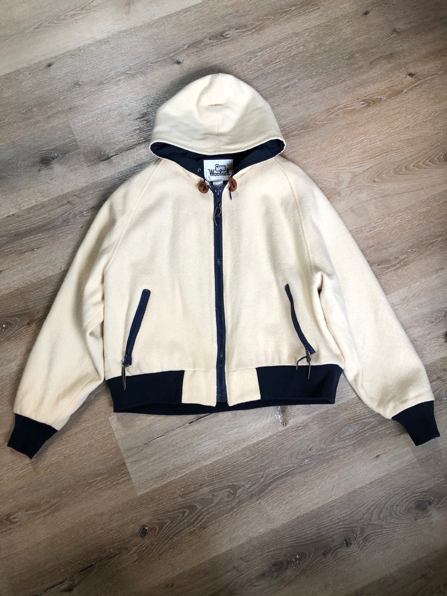 Kingspier Vintage - Woolrich white 100% wool jacket with hood, zipper closure, two zip pockets, knit trim and poly blend liner. Made in USA. Size XL.