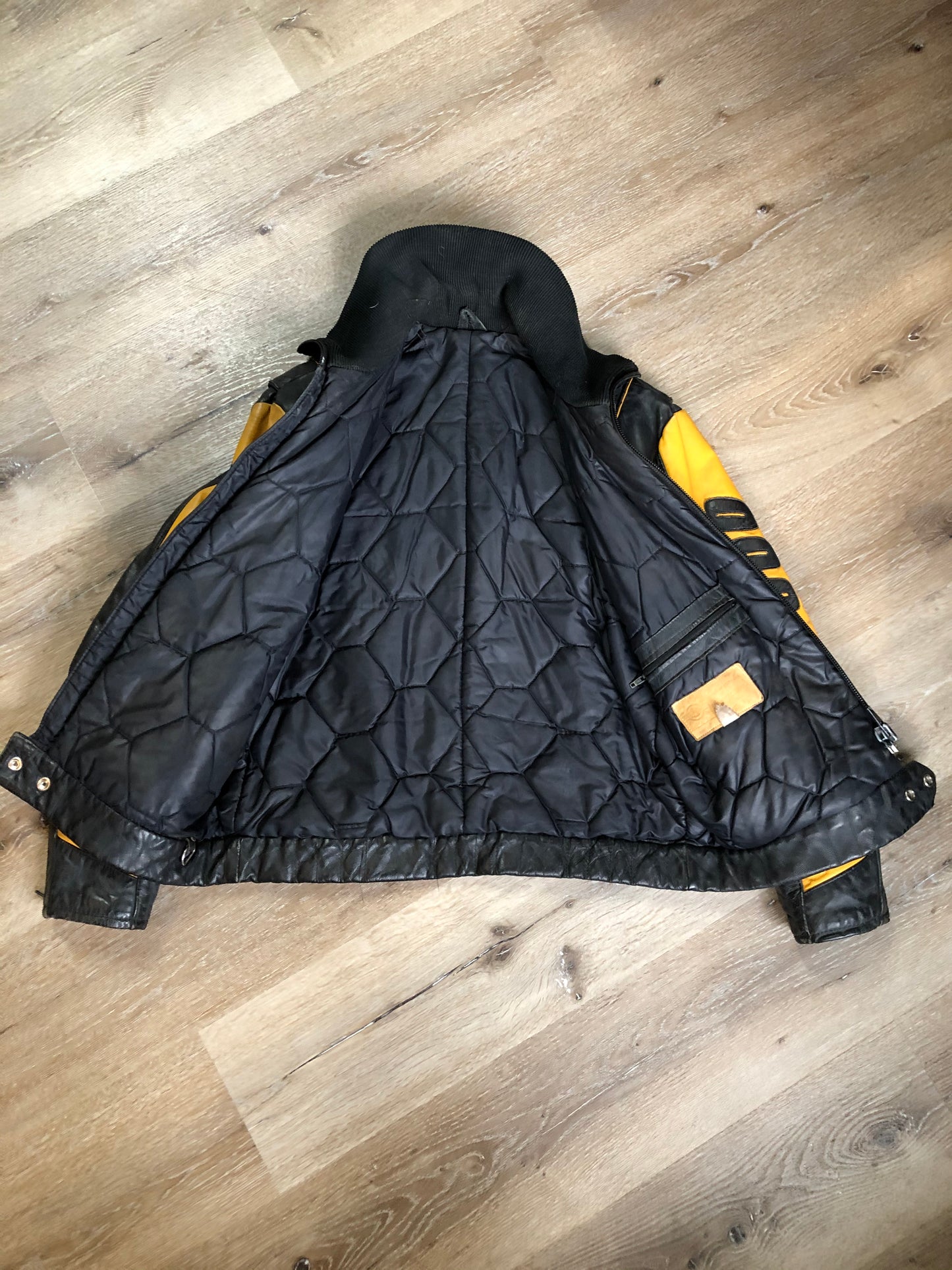 Kingspier Vintage - Bombardier Ski-Doo black and yellow leather jacket by Drospo with knit collar, zipper closure, zip pockets, quilted lining and one inside zip pocket. Made in Canada