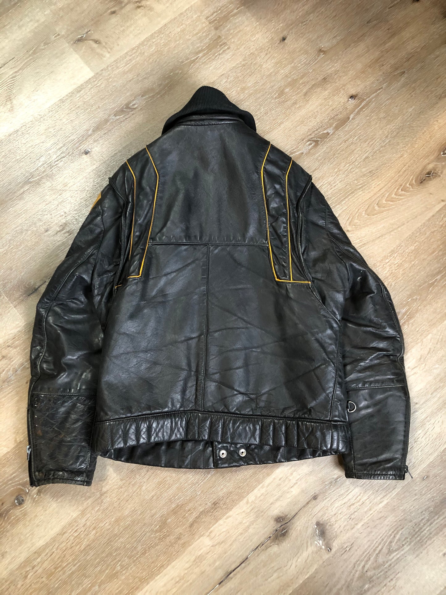 Kingspier Vintage - Bombardier Ski-Doo black and yellow leather jacket by Drospo with knit collar, zipper closure, zip pockets, quilted lining and one inside zip pocket. Made in Canada