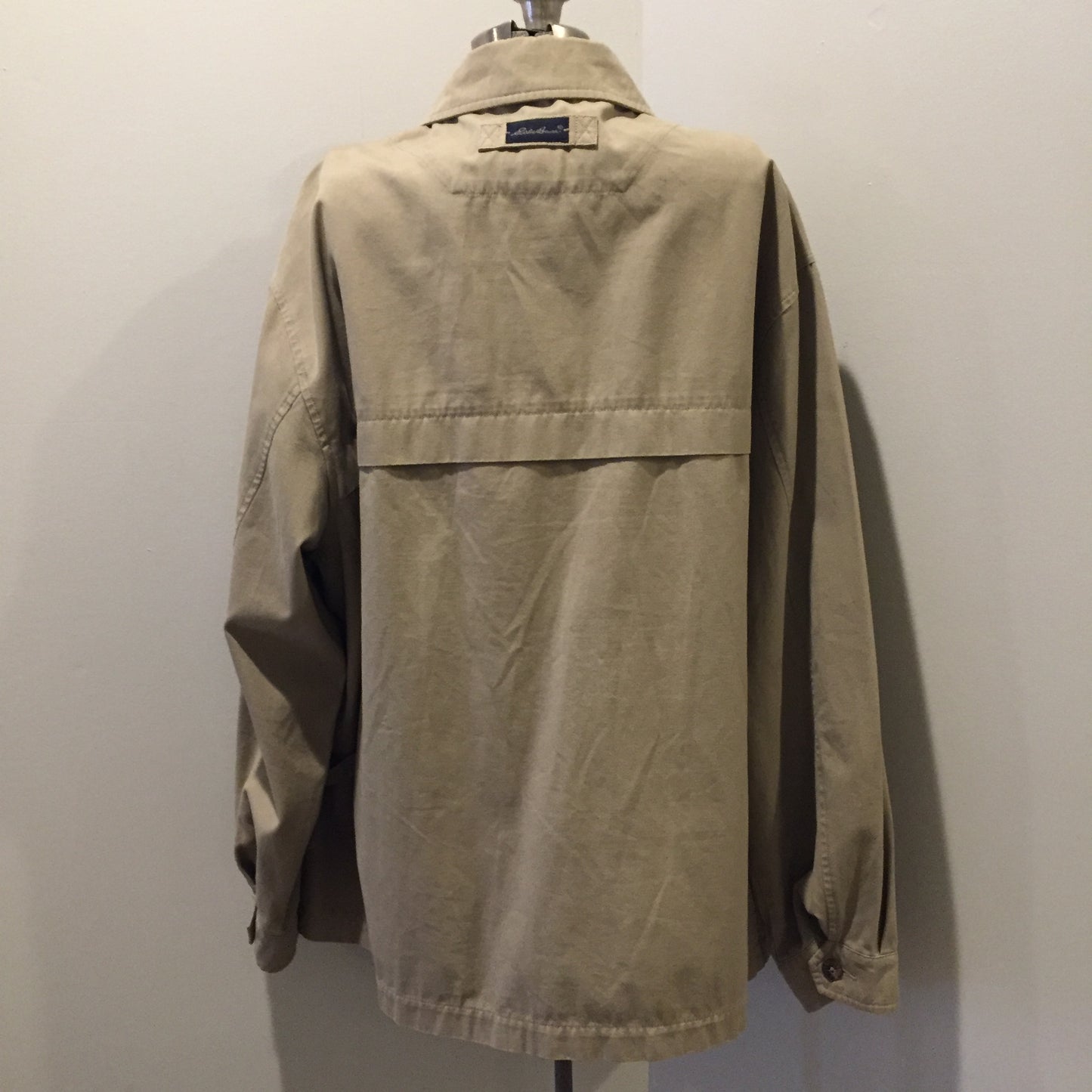 Kingspier Vintage - Eddie Bauer beige 100% cotton chore jacket with zipper closure and two flap pockets. Size large.