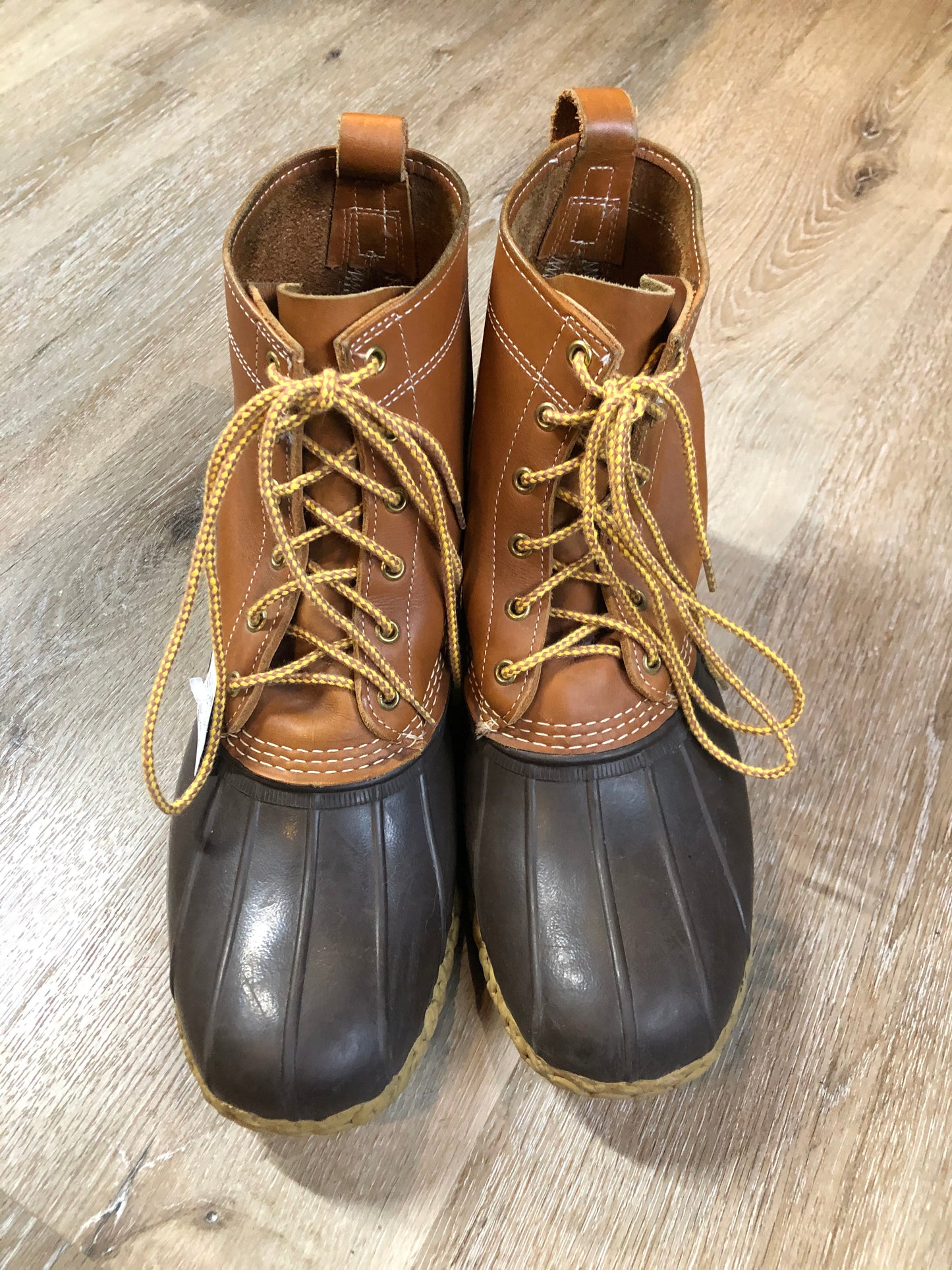Vintage LL Bean “Bean Boots” or “Duck Boots” 6 eyelet lace up rain boot with full grain leather upper and a waterproof rubber covering the foot and a rubber chain-tread outsole. Made in Maine, USA.
Size 12 Mens
The uppers and soles are in excellent condition.