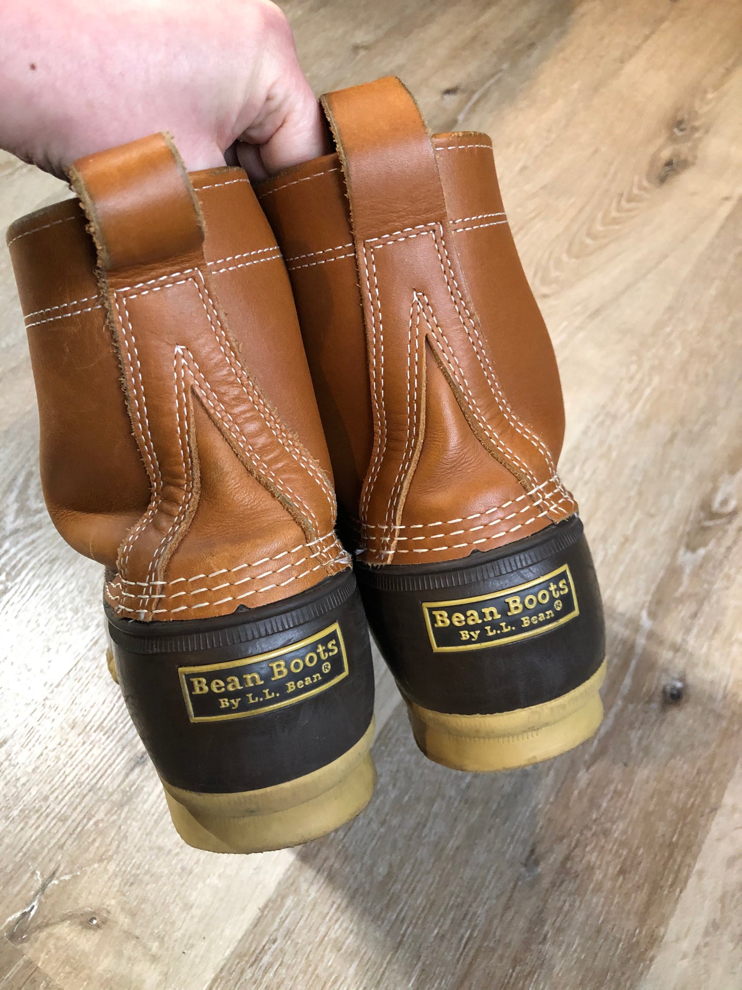 Vintage LL Bean “Bean Boots” or “Duck Boots” 6 eyelet lace up rain boot with full grain leather upper and a waterproof rubber covering the foot and a rubber chain-tread outsole. Made in Maine, USA.
Size 12 Mens
The uppers and soles are in excellent condition.