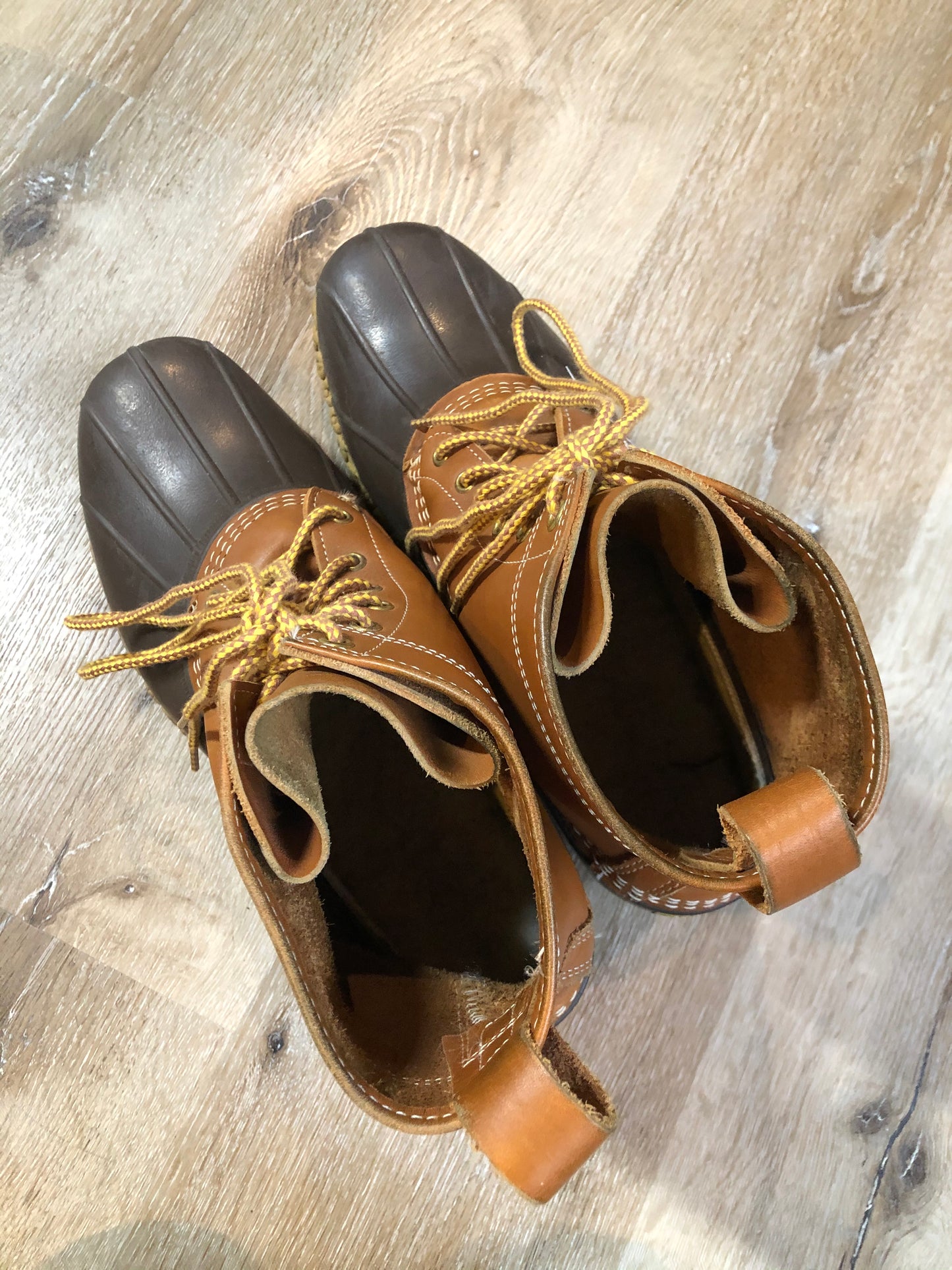 Vintage LL Bean “Bean Boots” or “Duck Boots” 6 eyelet lace up rain boot with full grain leather upper and a waterproof rubber covering the foot and a rubber chain-tread outsole. Made in Maine, USA.
Size 12 Mens
The uppers and soles are in excellent condition.