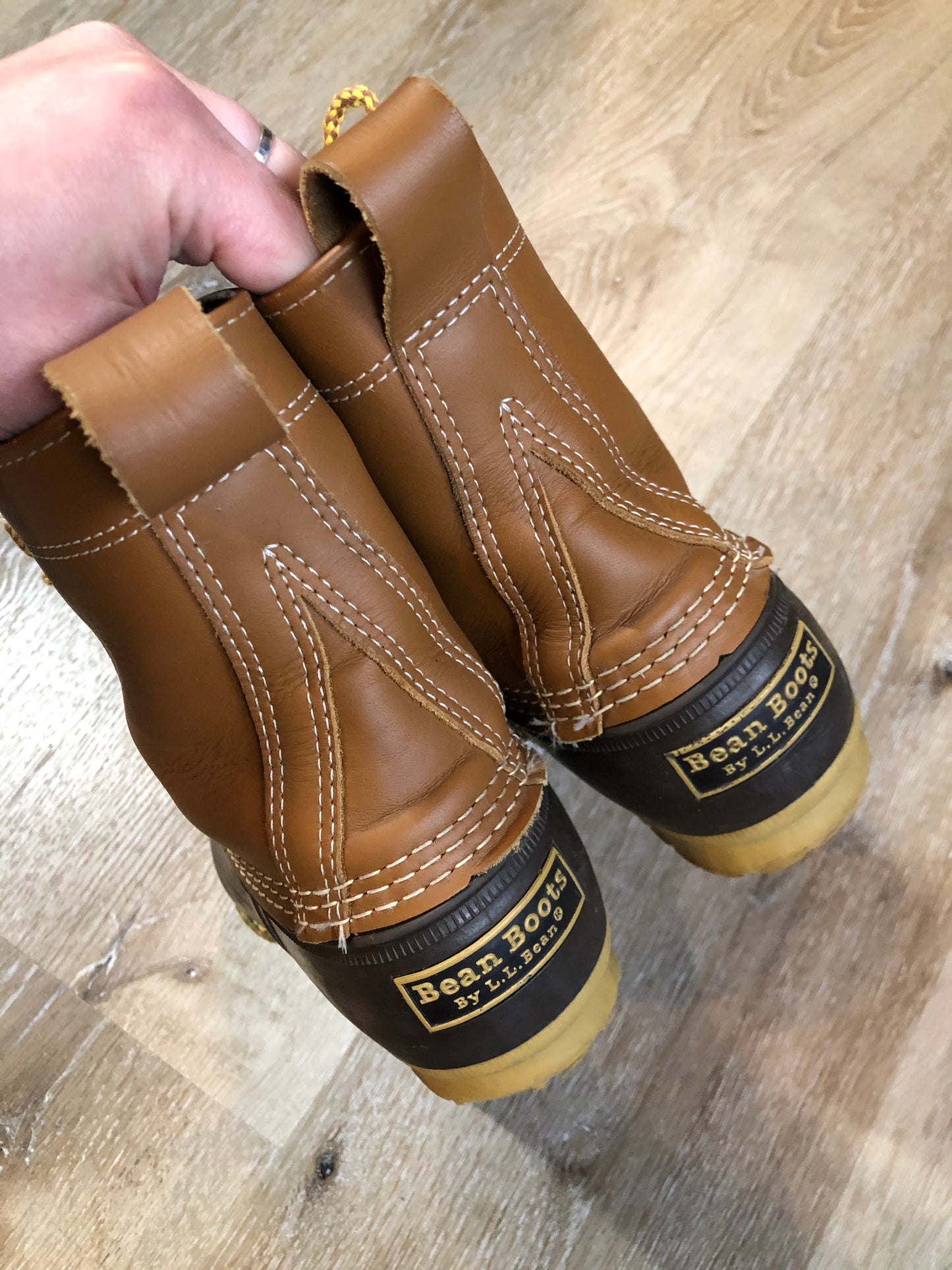 Vintage LL Bean “Bean Boots” or “Duck Boots” 6 eyelet lace up rain boot with full grain leather upper and a waterproof rubber covering the foot and a rubber chain- tread outsole. Made in Maine, USA.
Size 7.5 Womens
The uppers and soles are in excellent condition.