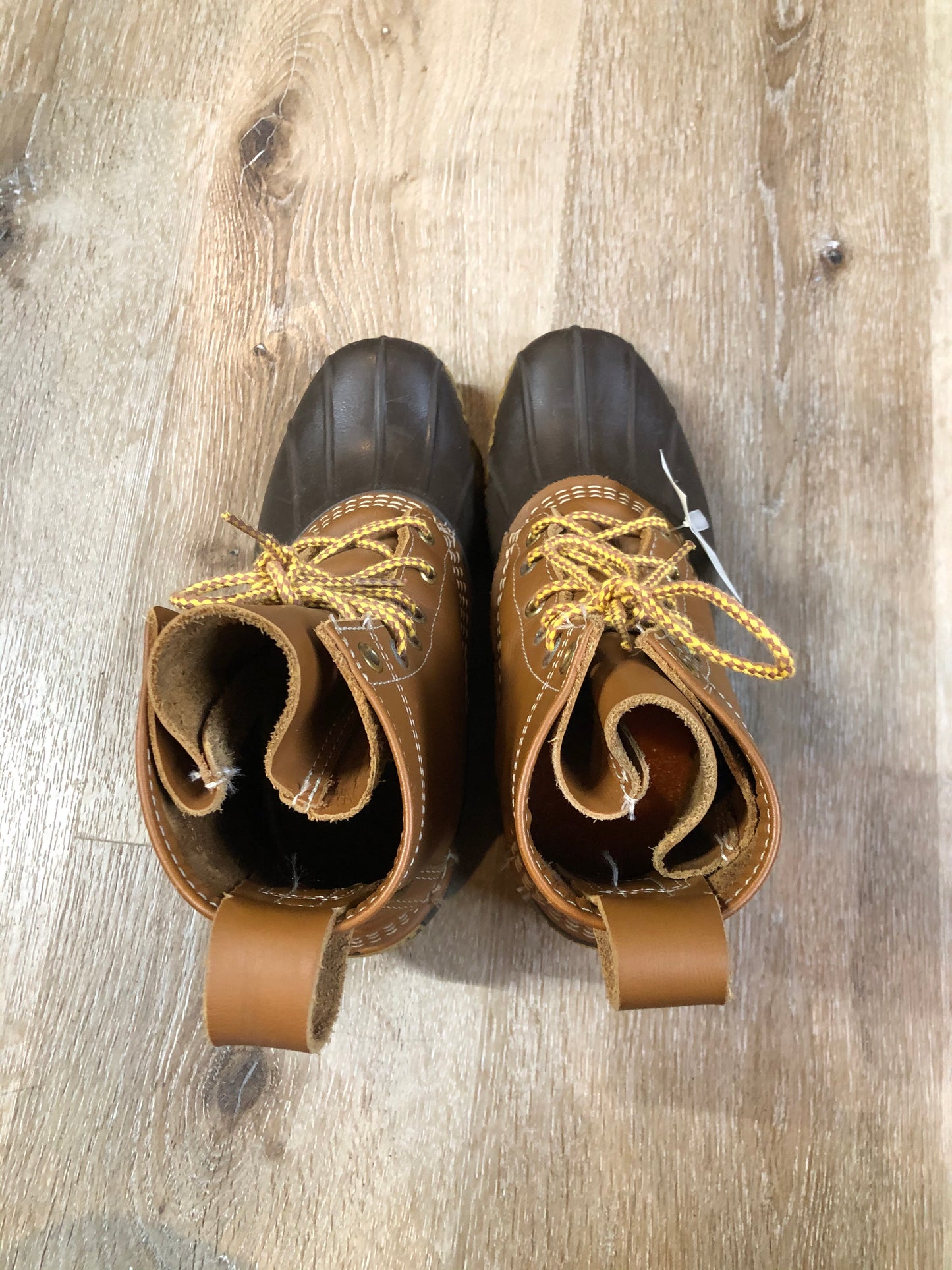 Vintage LL Bean “Bean Boots” or “Duck Boots” 6 eyelet lace up rain boot with full grain leather upper and a waterproof rubber covering the foot and a rubber chain- tread outsole. Made in Maine, USA.
Size 7.5 Womens
The uppers and soles are in excellent condition.