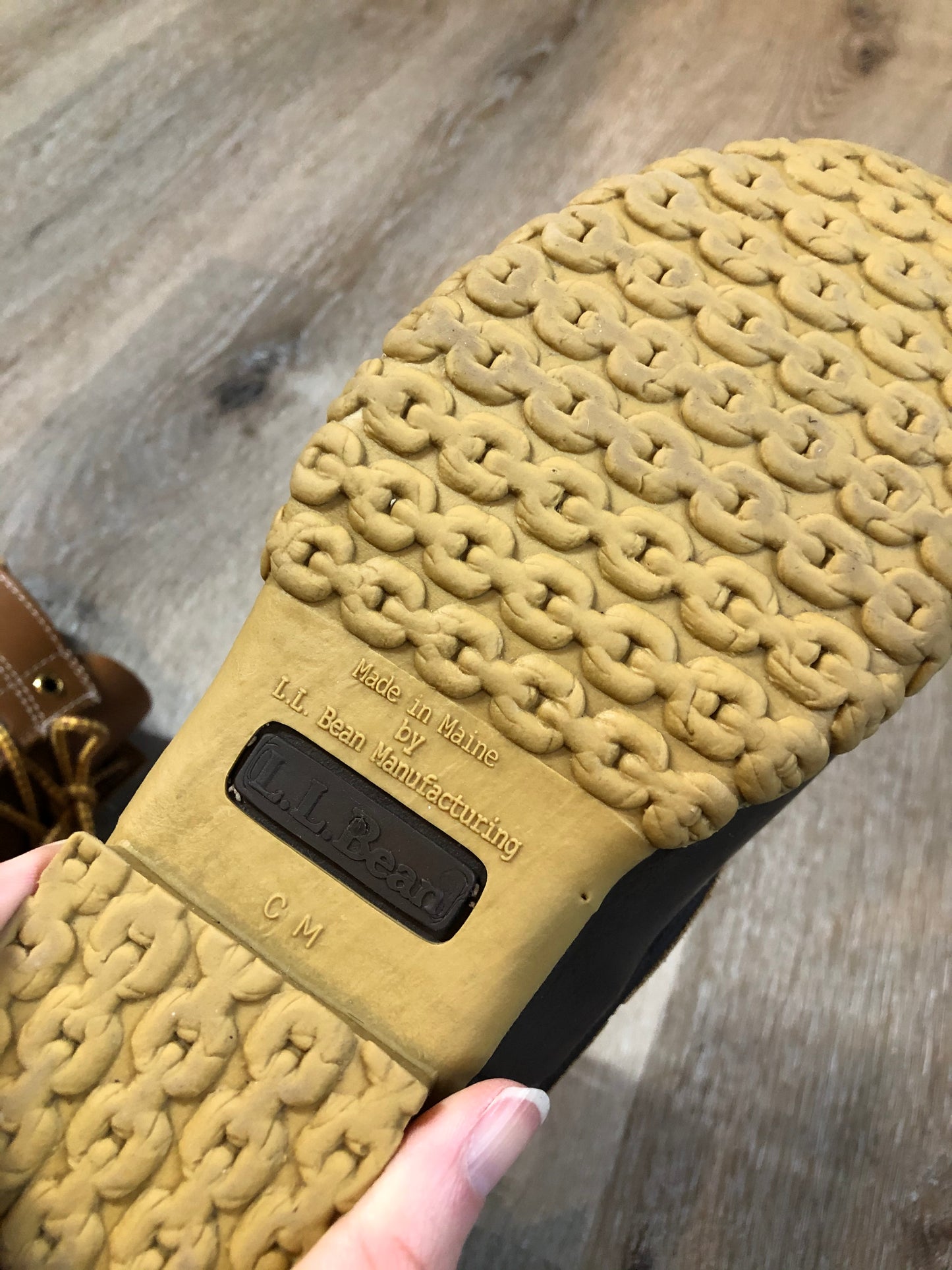 Vintage LL Bean “Bean Boots” or “Duck Boots” 6 eyelet lace up rain boot with full grain leather upper and a waterproof rubber covering the foot and a rubber chain- tread outsole. Made in Maine, USA.
Size 7.5 Womens
The uppers and soles are in excellent condition.