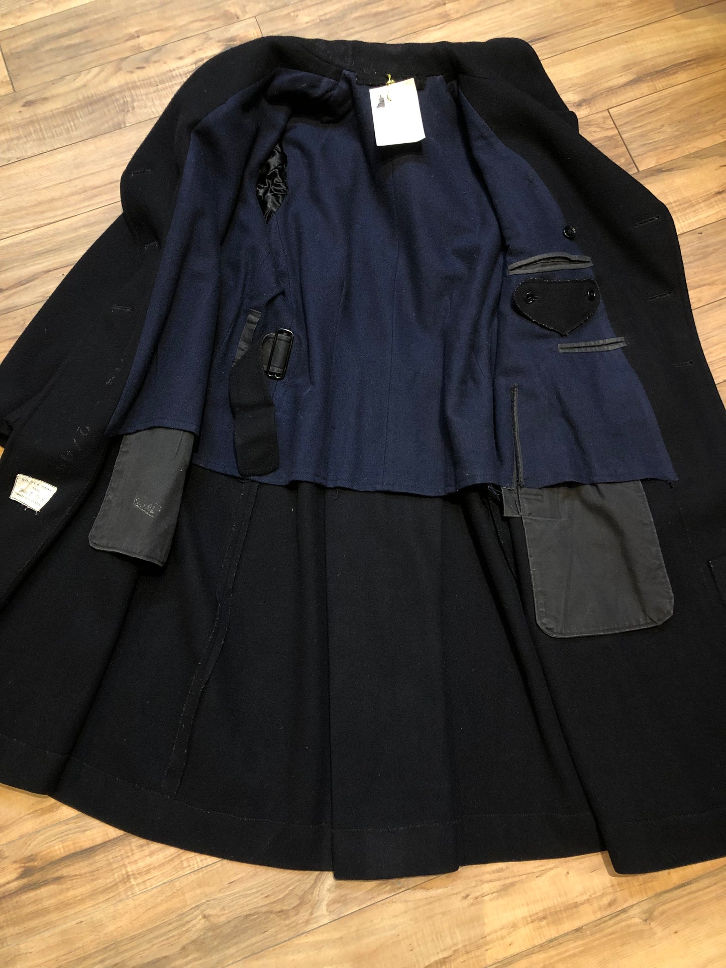 Kingspier Vintage - Rare Vintage 1940’s Bolter Bros Royal Canadian Sea Cadets double breasted long black wool coat. This coat features button closures, partial lining, two front pockets and two inside pockets.
Size 2/ 5ft 8
Made in Canada.