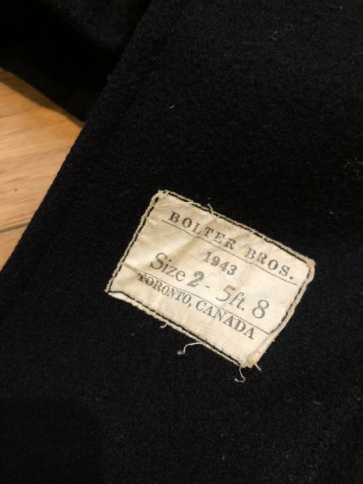 Kingspier Vintage - Rare Vintage 1940’s Bolter Bros Royal Canadian Sea Cadets double breasted long black wool coat. This coat features button closures, partial lining, two front pockets and two inside pockets.
Size 2/ 5ft 8
Made in Canada.