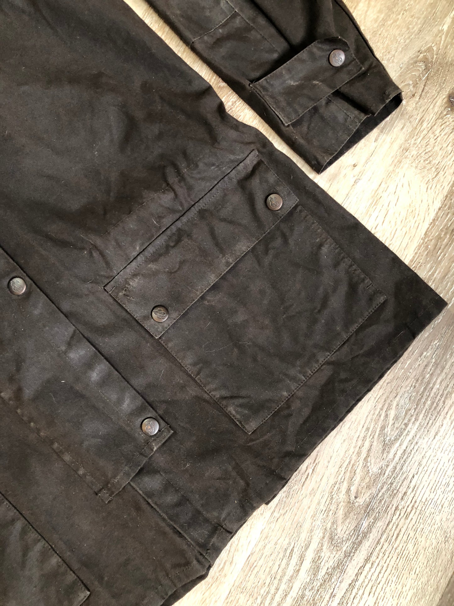 Kingspier Vintage - Outback Trading Co brown cotton oilskin rancher jacket with double snap closures, two snap flap pockets, one inside zip pocket, lightweight lining and drawstring at the waist. Fits large.