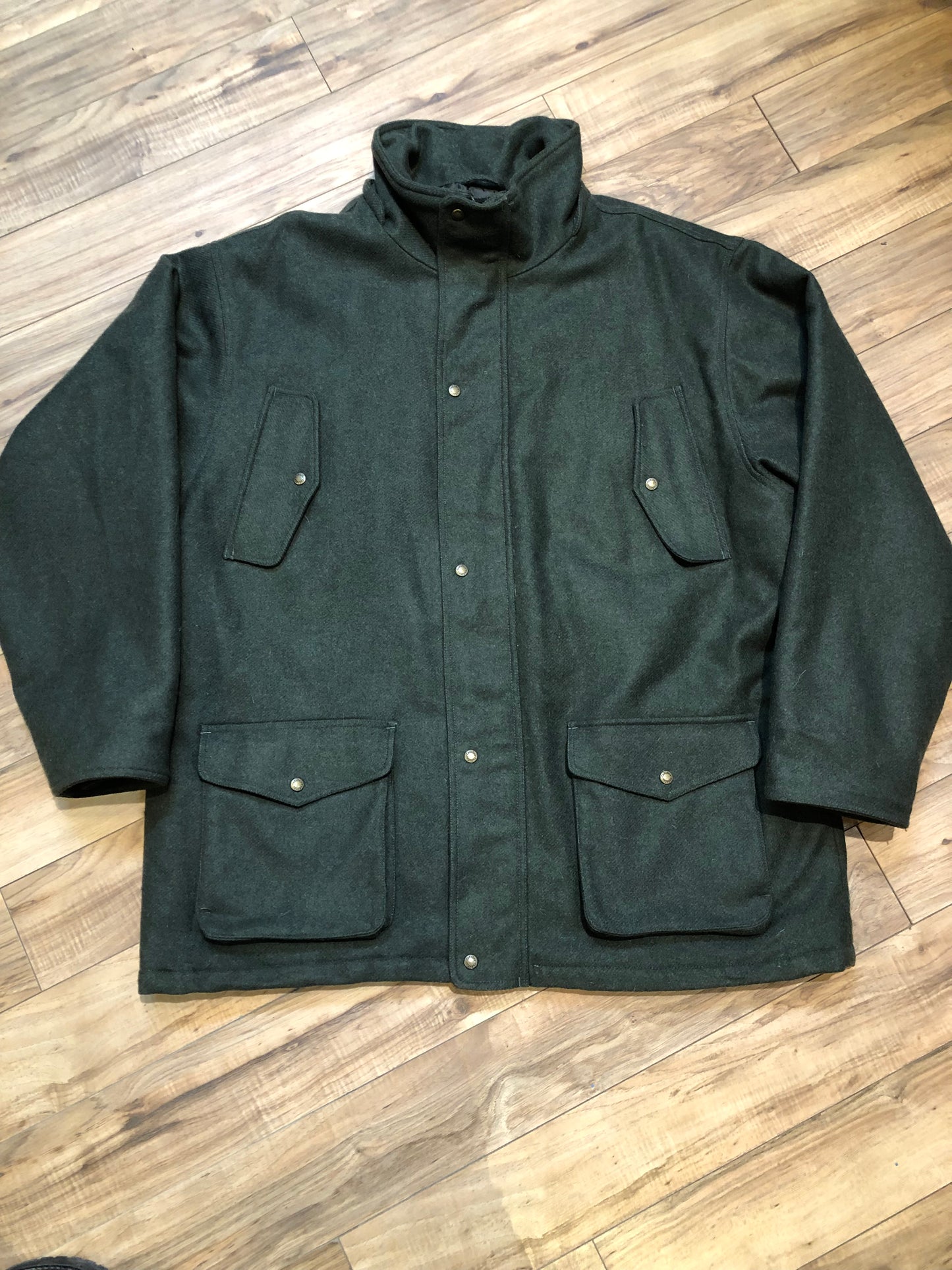 Kingspier Vintage - Cabela’s Dry Plus green 100% wool hunting jacket with snap and zipper closures, four front pockets and one back pocket.
Size 3XL Tall.