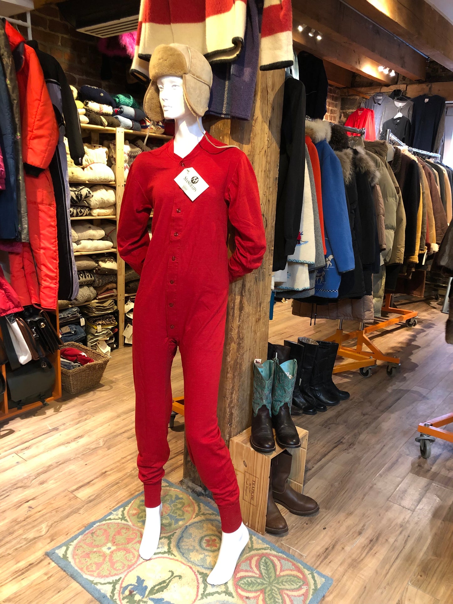 Kingspier Vintage - Stanfield''s deadstock duofold / layered jersey knit union suits in red or grey. The Stanfield's union suits are ingeniously designed with wicking and insulating layers of wool and cotton blends and have been a "staple" of Stanfield’s for many decades. Inner Layer: 50% Cotton/ 50% Polyester Outer Layer: 50% merino wool/ 50% Polyester These onsies are irregular/seconds...we're calling them “I’mperfects” as imperfections are undetectable.
