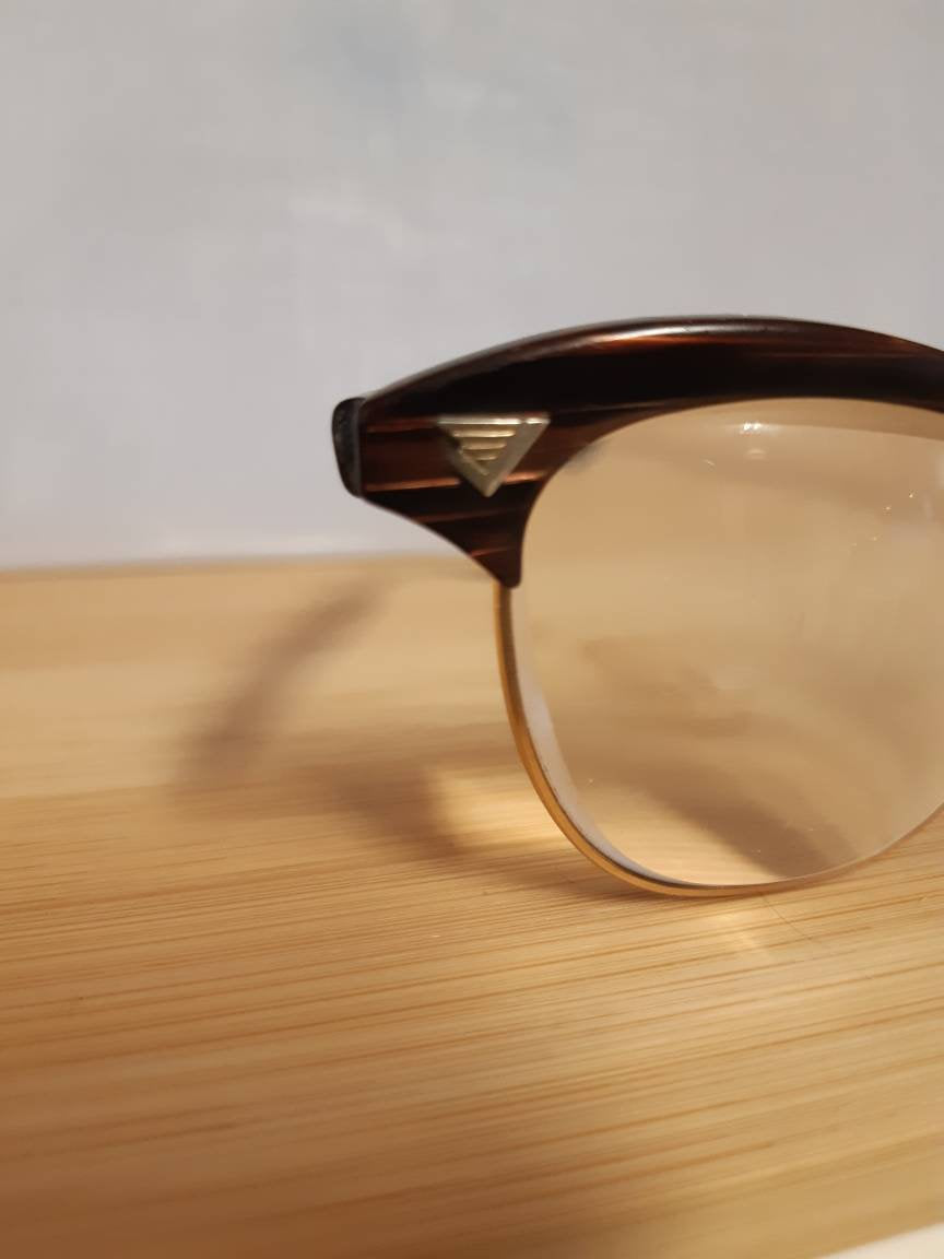 Extremely rare vintage redwood & gold American Optical Sirmont combination eyeglasses made famous by Malcolm X, SOLD