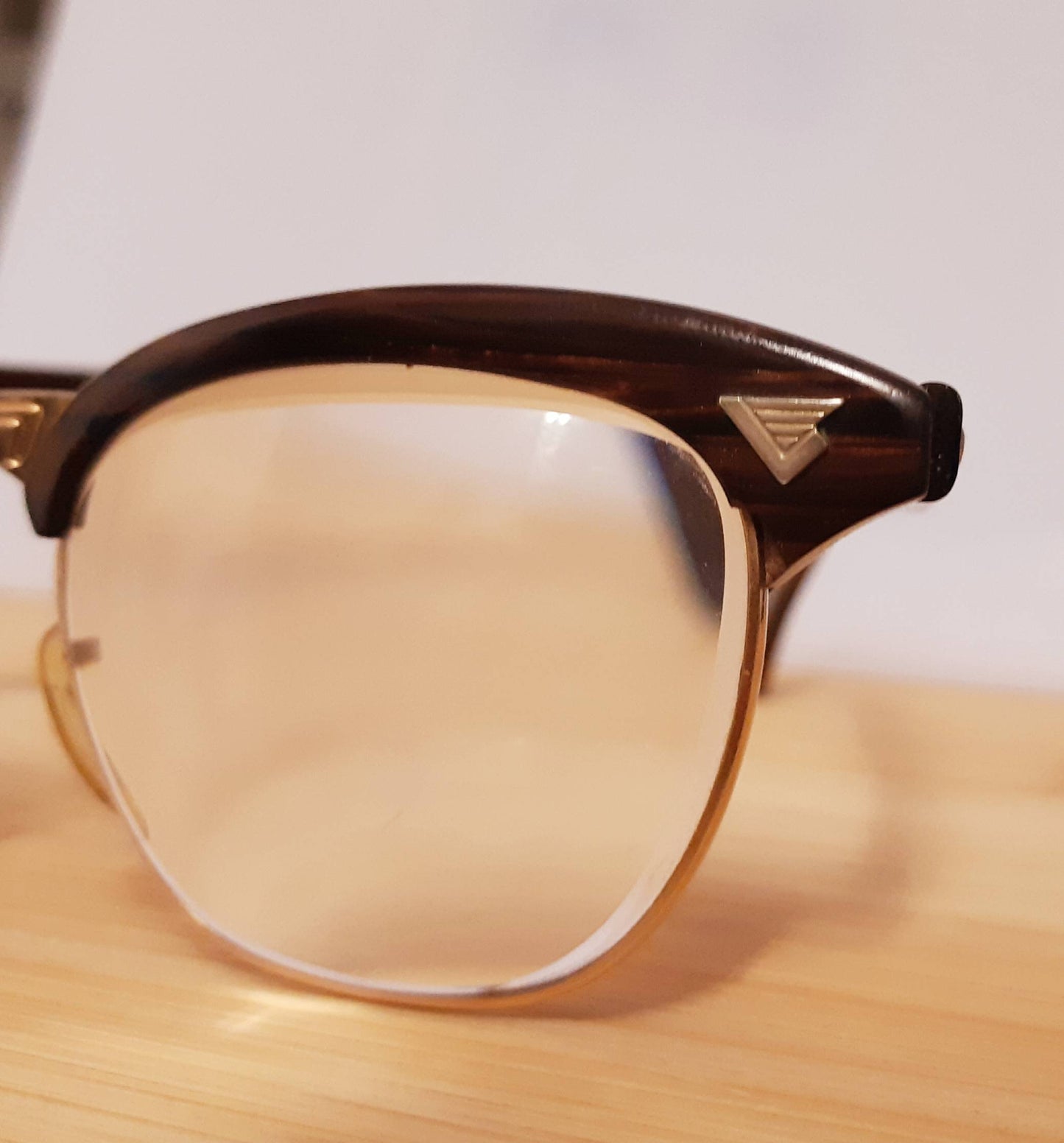 Extremely rare vintage redwood & gold American Optical Sirmont combination eyeglasses made famous by Malcolm X, SOLD