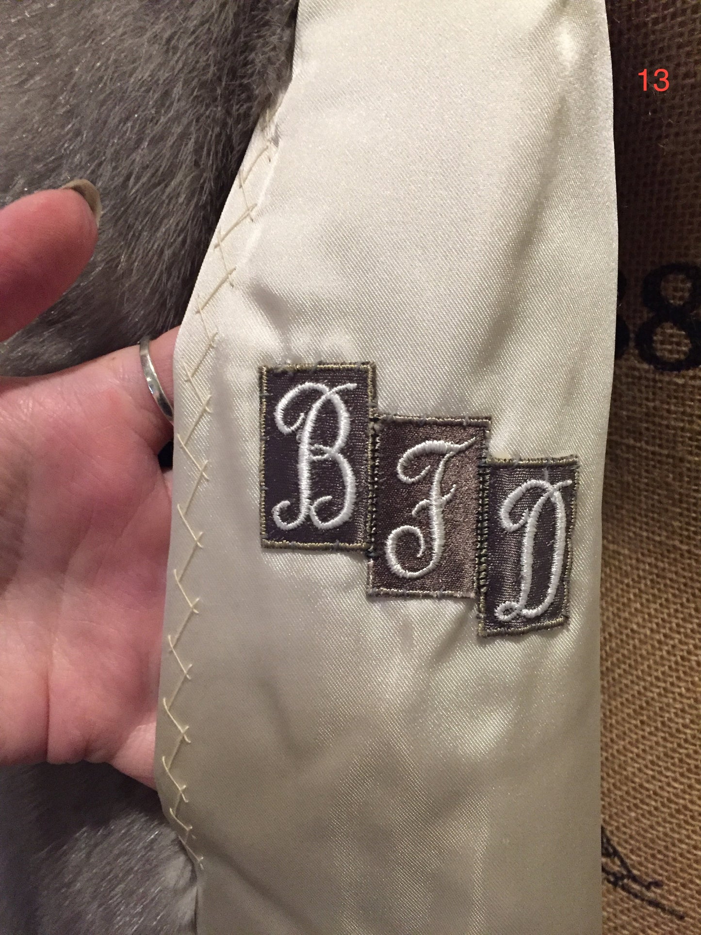 Kingspier Vintage - Eastern Furriers" Silver mink fur coat, Made in Canada. This coat features a white satin lining with inside pocket and embroidered monogram "BFD" and Eastern Furriers label.