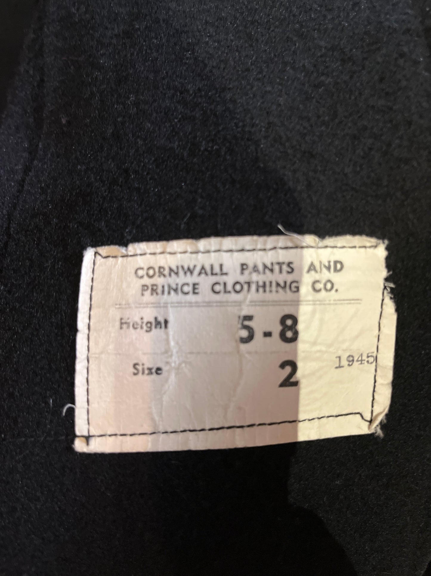 Vintage black 100% wool double breasted long naval uniform coat by Cowell Prince Pants and Clothing Co. with partial lining, two front pockets and two inside pockets.
Size 2, chest 44”