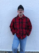 Load image into Gallery viewer, Kingspier Vintage - Johnson Woolen Mills red plaid wool hunting jacket with button closures, inside knit cuffs to keep cold air out, four flap pockets, two hand warming pockets, two side zip pockets and one inside pocket.
