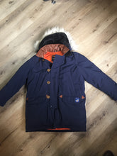 Load image into Gallery viewer, Kingspier Vintage - Rare Snow Goose parka from the 1970’s/1980’s (former name of Canada Goose) in navy with leather details and fur trimmed hood, slash pockets, flap pockets, zipper and button closures, “Snow Goose” patch on the front pocket, orange lining. Made in Canada. Size 40M. 
