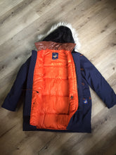 Load image into Gallery viewer, Kingspier Vintage - Rare Snow Goose parka from the 1970’s/1980’s (former name of Canada Goose) in navy with leather details and fur trimmed hood, slash pockets, flap pockets, zipper and button closures, “Snow Goose” patch on the front pocket, orange lining. Made in Canada. Size 40M. 
