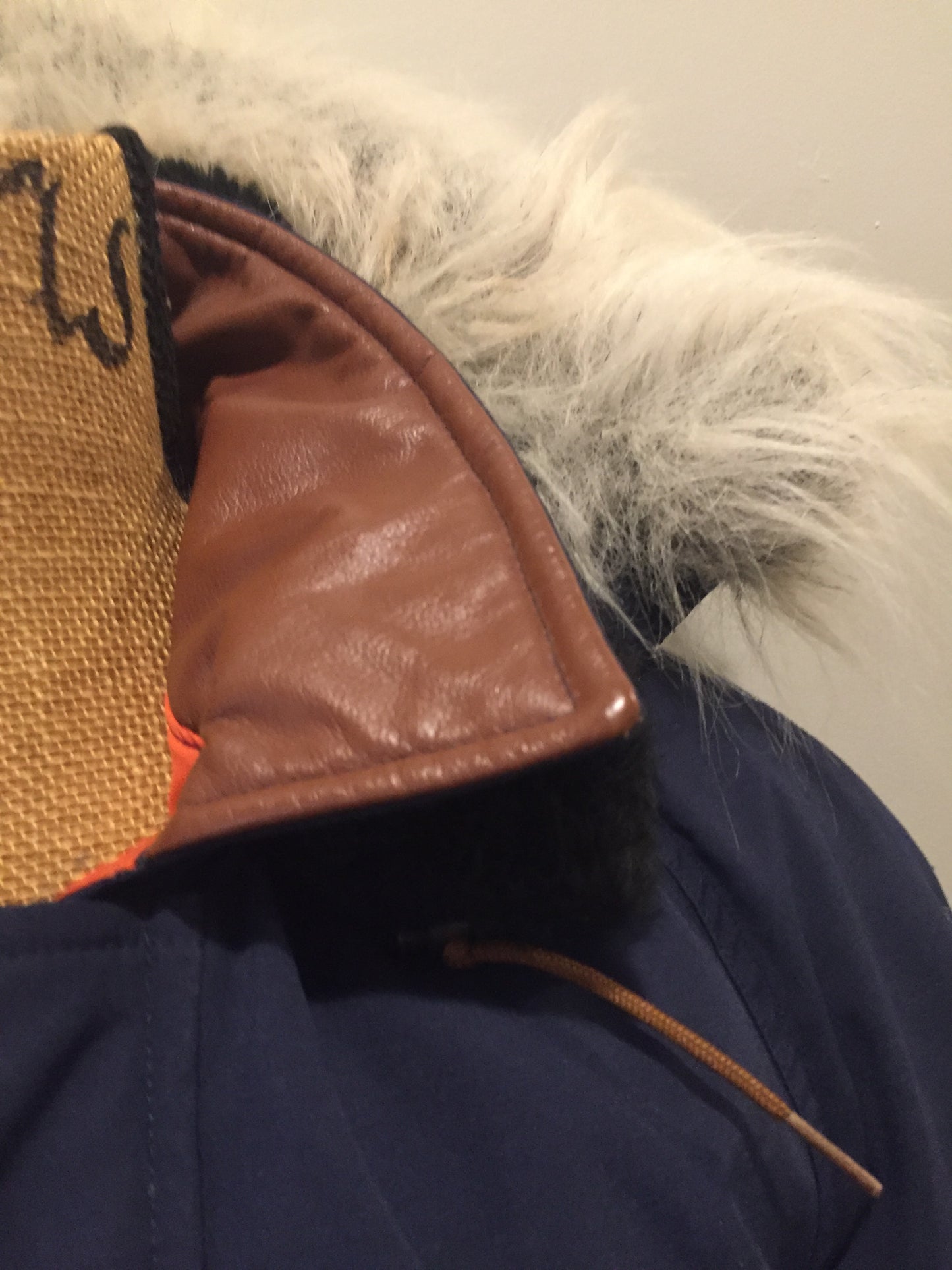 Kingspier Vintage - Rare Snow Goose parka from the 1970’s/1980’s (former name of Canada Goose) in navy with leather details and fur trimmed hood, slash pockets, flap pockets, zipper and button closures, “Snow Goose” patch on the front pocket, orange lining. Made in Canada. Size 40M. 