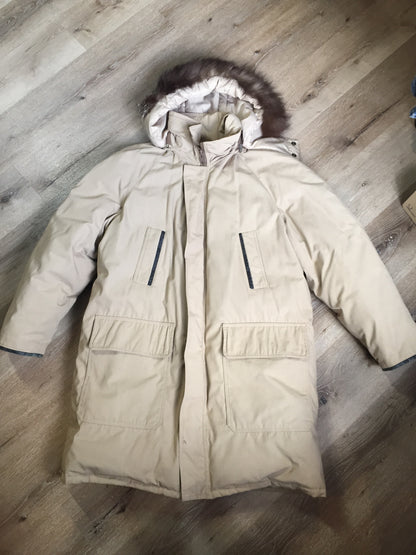 Kingspier Vintage - Retreat down filled parka in beige with fur trimmed hood, leather trim, slash pockets and flap pockets and zipper closure. Size 37.5” (chest).