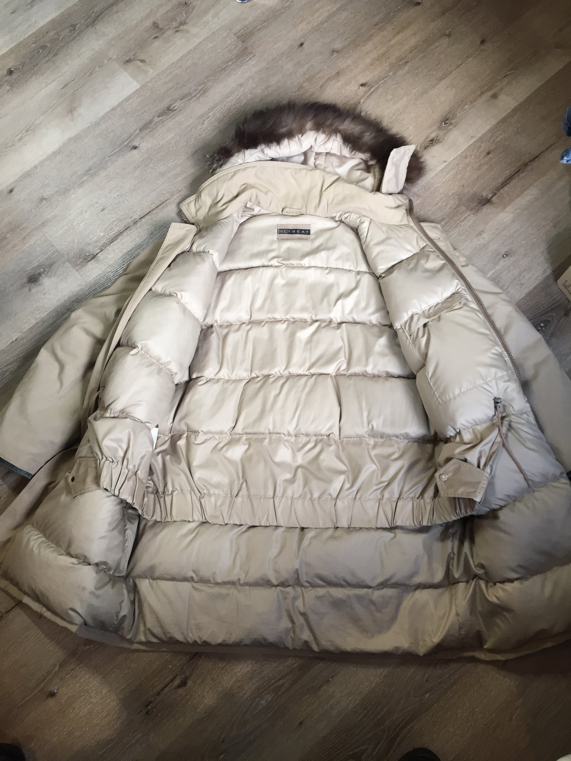 Kingspier Vintage - Retreat down filled parka in beige with fur trimmed hood, leather trim, slash pockets and flap pockets and zipper closure. Size 37.5” (chest).