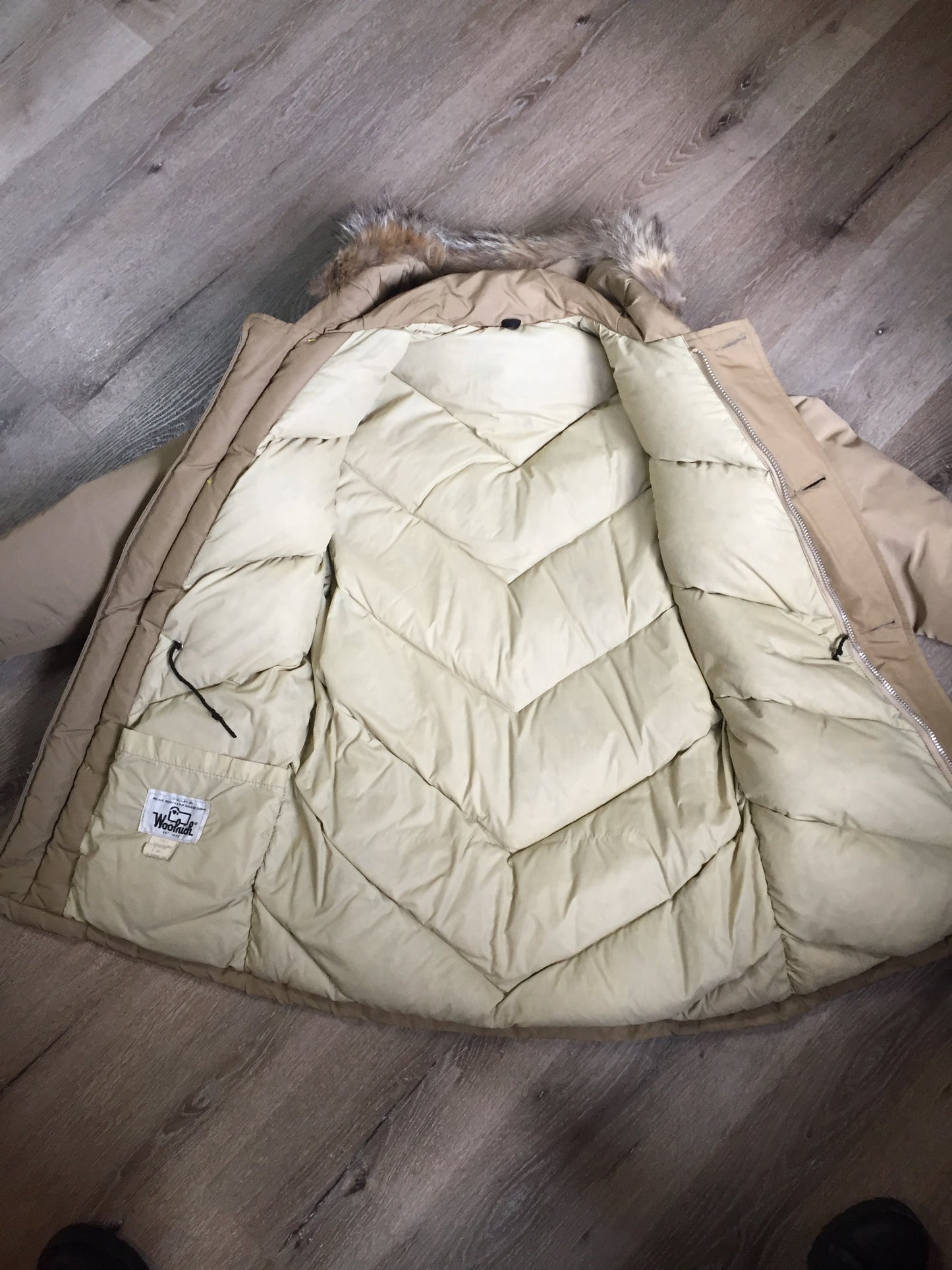 Kingspier Vintage - Woolrich goose down parka in beige with fur trimmed hood, slash pockets and flap pockets and inside pocket, zipper and button closures, Size small.