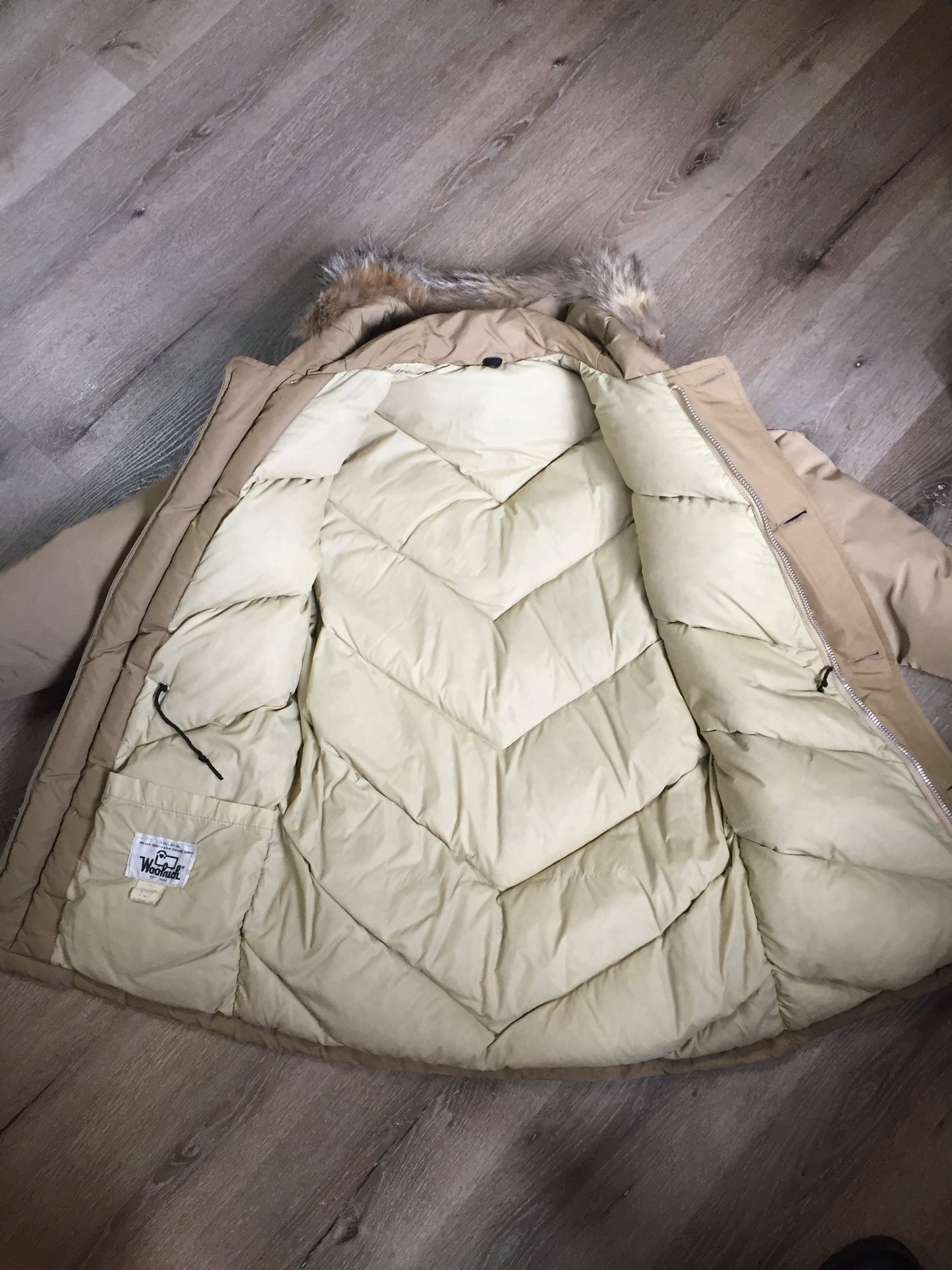 Kingspier Vintage - Woolrich goose down parka in beige with fur trimmed hood, slash pockets and flap pockets and inside pocket, zipper and button closures, Size small.