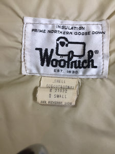 Kingspier Vintage - Woolrich goose down parka in beige with fur trimmed hood, slash pockets and flap pockets and inside pocket, zipper and button closures, Size small.