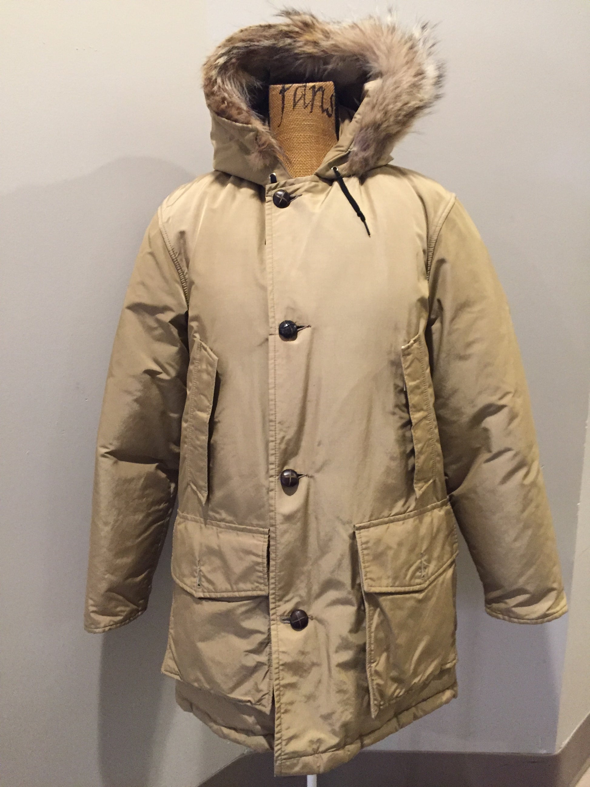 Kingspier Vintage - Woolrich goose down parka in beige with fur trimmed hood, slash pockets and flap pockets and inside pocket, zipper and button closures, Size small.