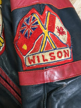 Load image into Gallery viewer, Kingspier Vintage - NS Sanitorium Fire Department green leather varsity jacket with red details, snap closures, slash pockets, embroidered emblem on the chest, embroidered monogram on the arm and shearling lining.
