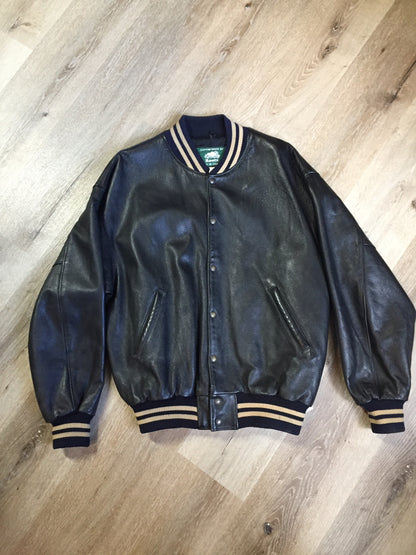 Kingspier Vintage - Roots leather varsity jacket in black with blue and brown ribbing, snap closures and slash pockets. Size large.