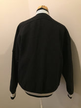 Load image into Gallery viewer, Kingspier Vintage - Retreat wool varsity jacket in black with ”Canada” printed on the chest,
